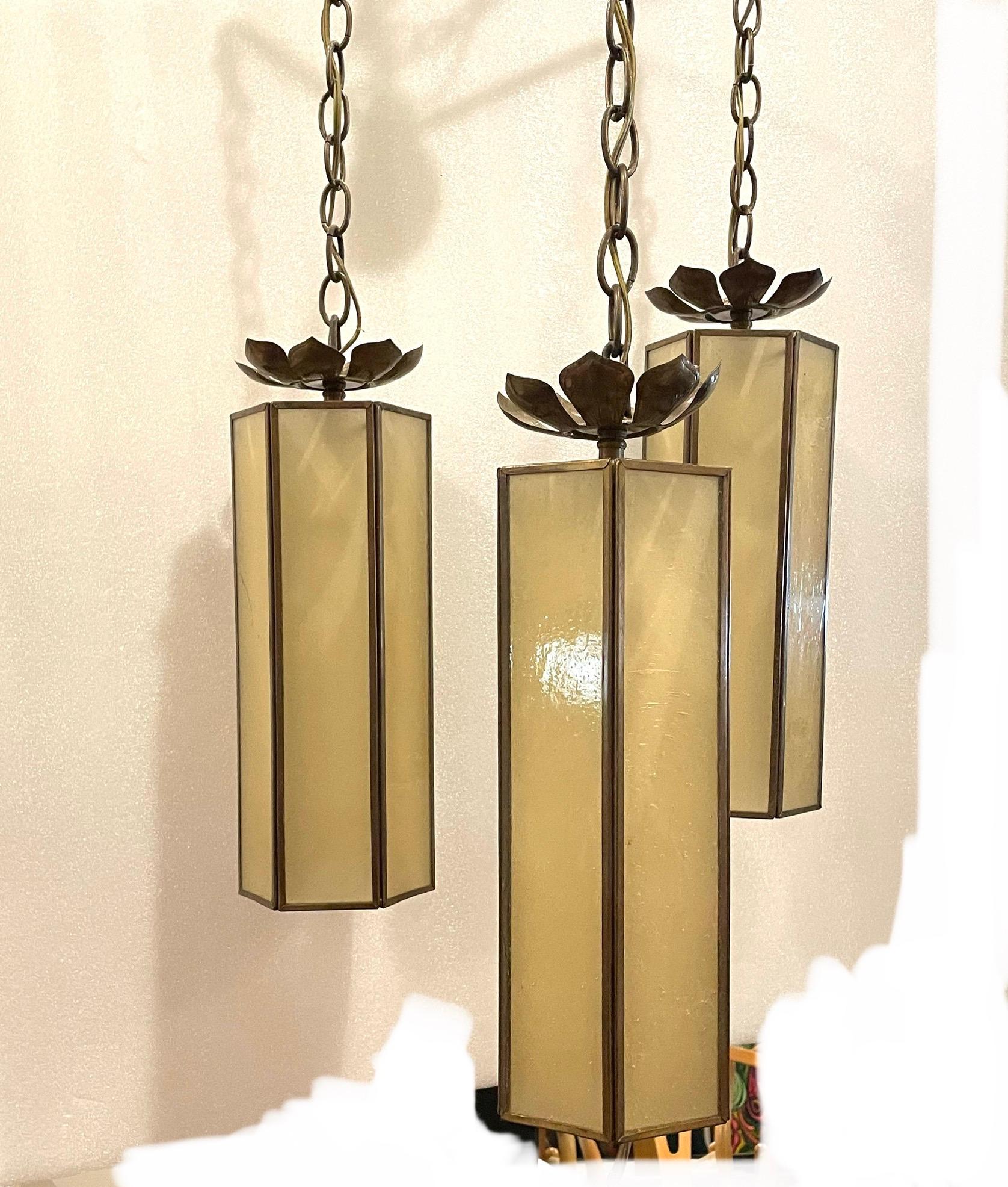 Beautiful decorative 3 tear chandelier freshly rewired patinated brass and glass.