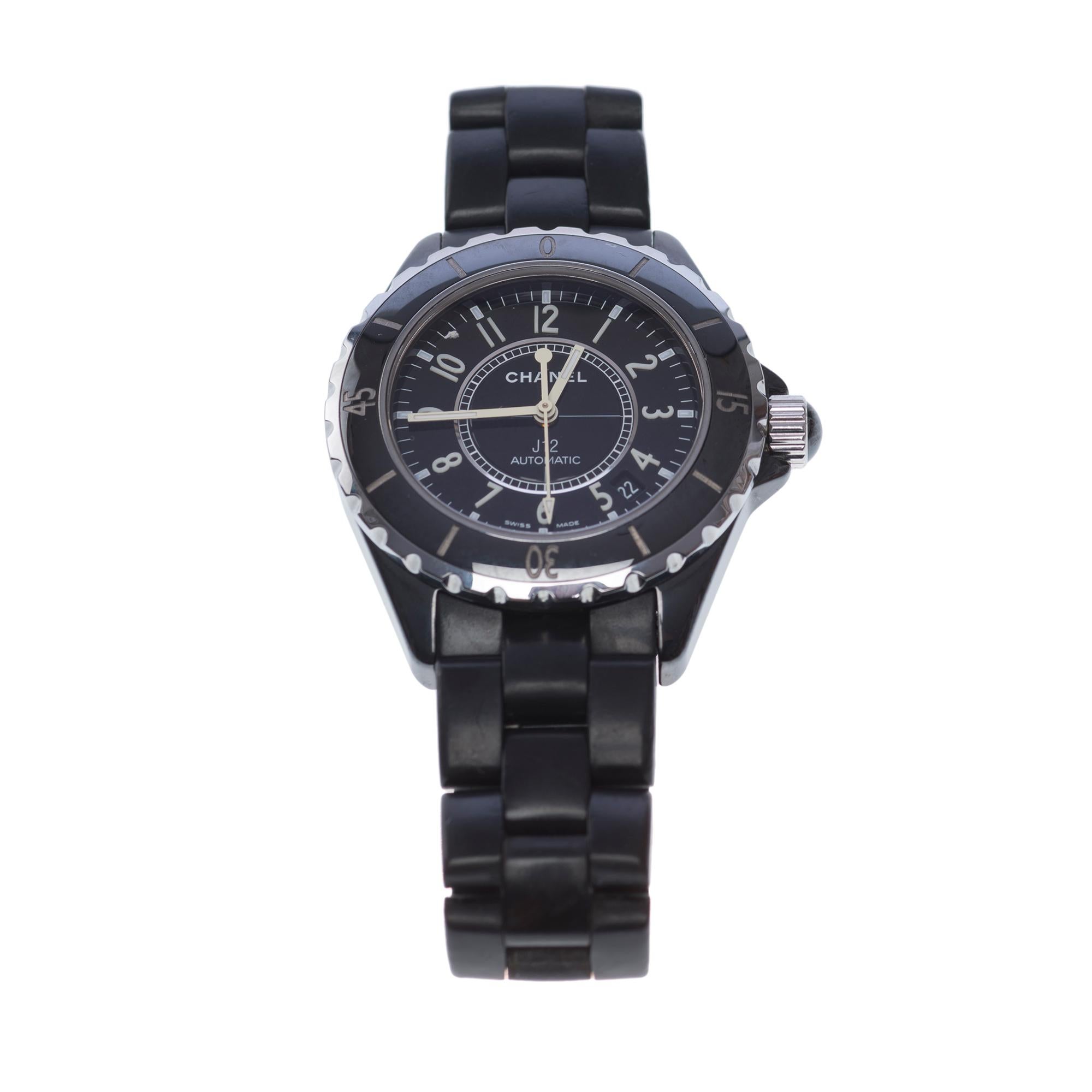 Chanel​ ​J12​ ​automatic​ ​black​ ​ceramic​ ​wristwatch
Round​ ​ceramic​ ​case,​ ​screwed​ ​bottom,​ ​unidirectional​ ​rotating​ ​graduated​ ​bezel,​ ​screwed​ ​crown​ ​set​ ​with​ ​a​ ​cabochon

Dial​ ​silver​ ​timer​ ​railroad,​ ​automatic​