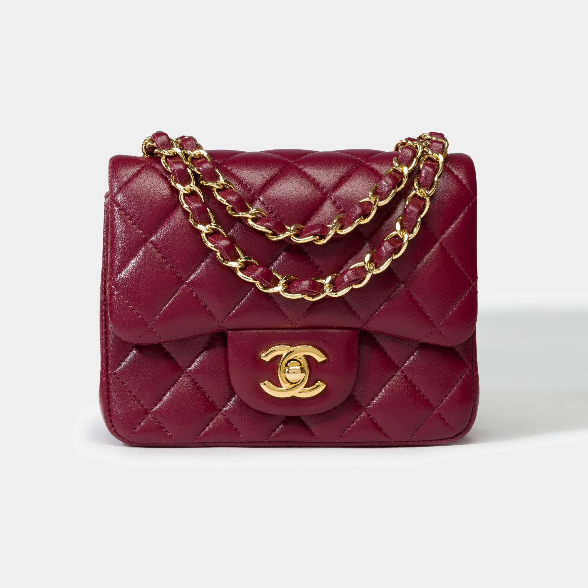 Stunning​ ​&​ ​Rare​ ​Chanel​ ​Mini​ ​Timeless​ ​shoulder​ ​flap​ ​bag​ ​in​ ​plum​ ​quilted​ ​lambskin leather ,​ ​gold​ ​metal​ ​chain​ ​handle​ ​interlaced​ ​with​ ​plum​ ​leather​ ​allowing​ ​a​ ​hand​ ​or​ ​shoulder​ ​or​ ​crossbody​