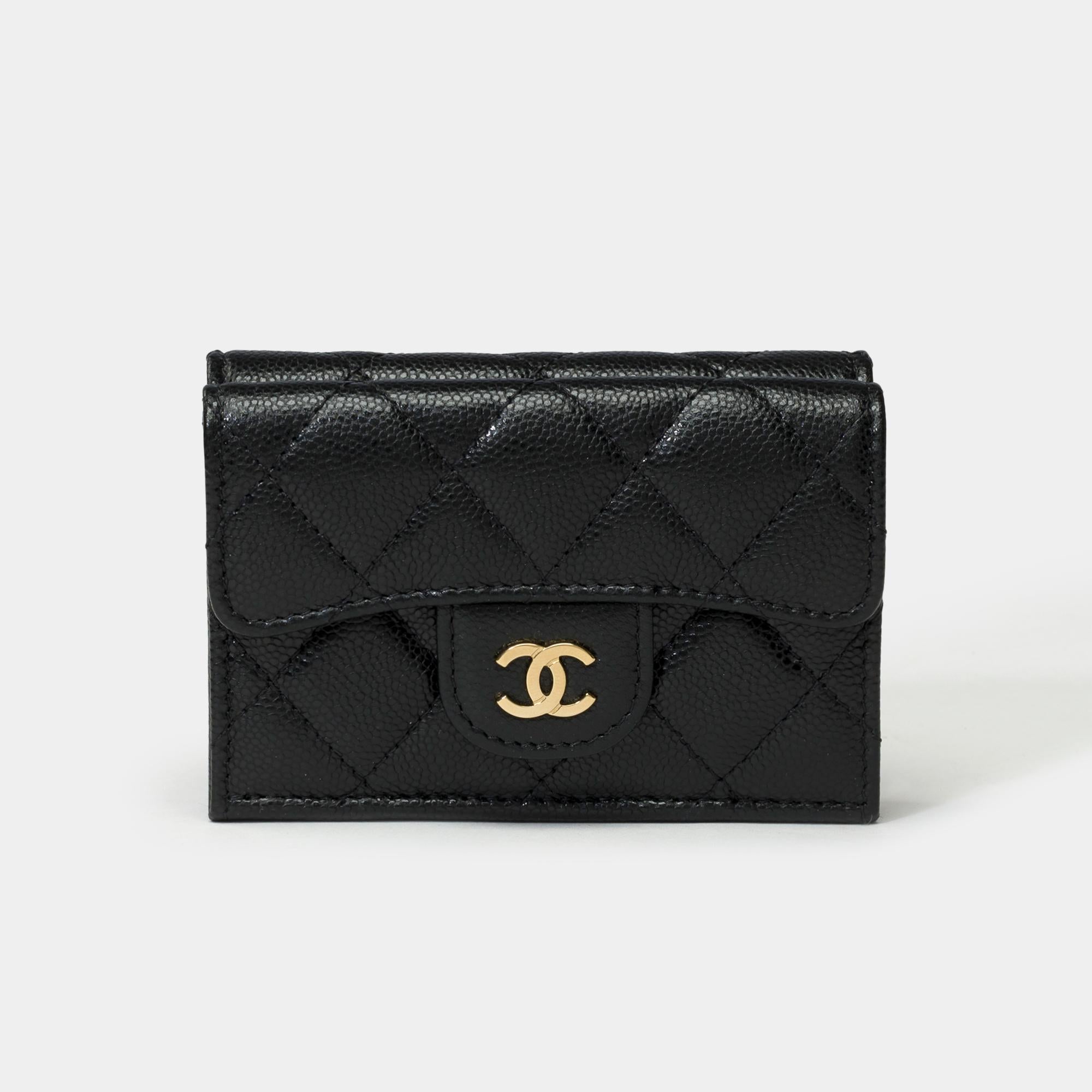 Gorgeous​ ​Chanel​ ​Wallet​ ​in​ ​black​ ​quilted​ ​caviar​ ​leather,​ ​gold​ ​metal​ ​trim

A​ ​flap​ ​compartment​ ​at​ ​the​ ​front​ ​of​ ​the​ ​bag,​ ​snap​ ​closure​ ​CC​ ​logo​ ​in​ ​gold​ ​metal
Shutter​ ​closure​ ​by​ ​silver​ ​metal​ ​snap​