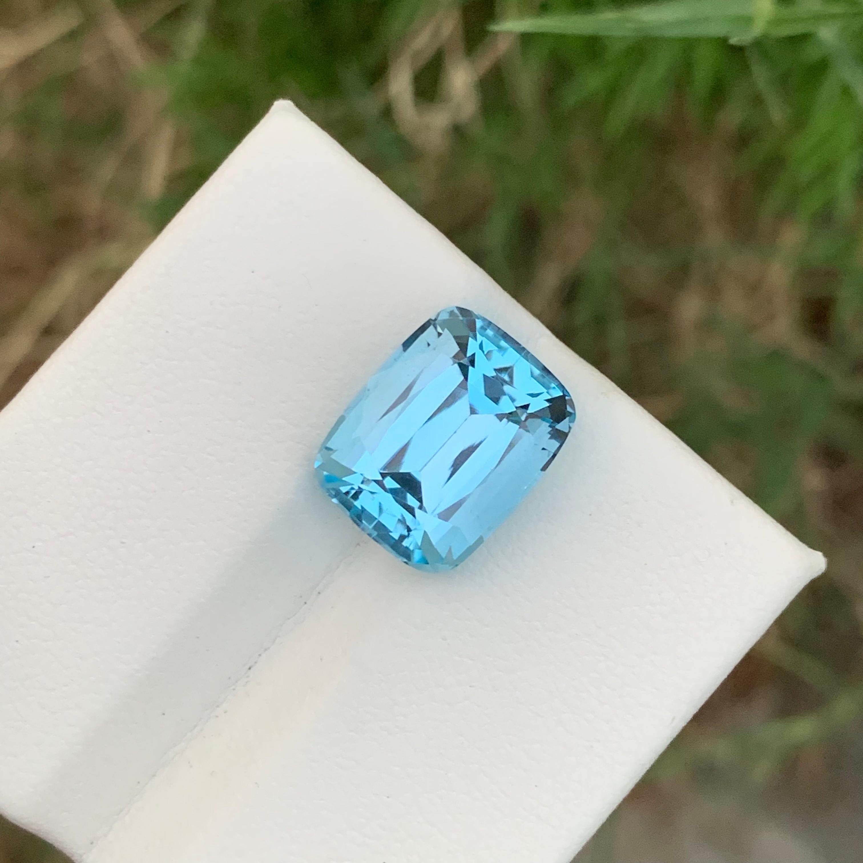 Loose Blue Topaz 
Weight: 12.0 Carats 
Dimension: 14.3x11.5x9.1 Mm
Origin: Brazil
Color: Sky Blue
Shape: Cushion 
Certificate: On Customer Demand 
.
The sky blue topaz is a stunning gemstone known for its enchanting hue reminiscent of a clear,