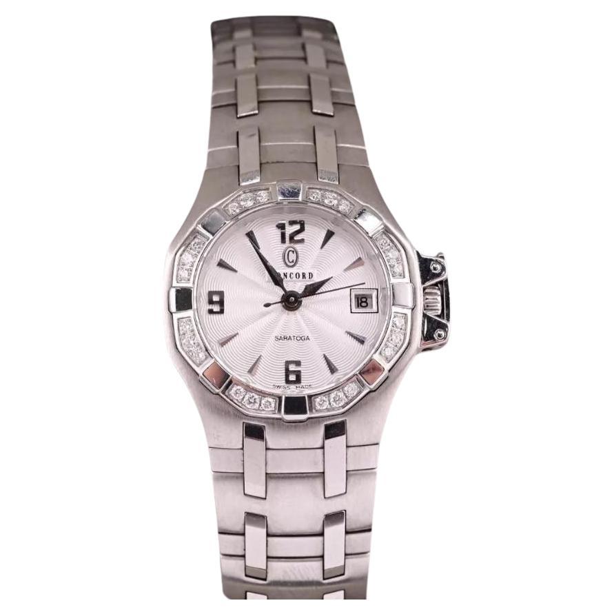 Magnifique montre à quartz Concord Saratoga en acier inoxydable et diamants pour femmes