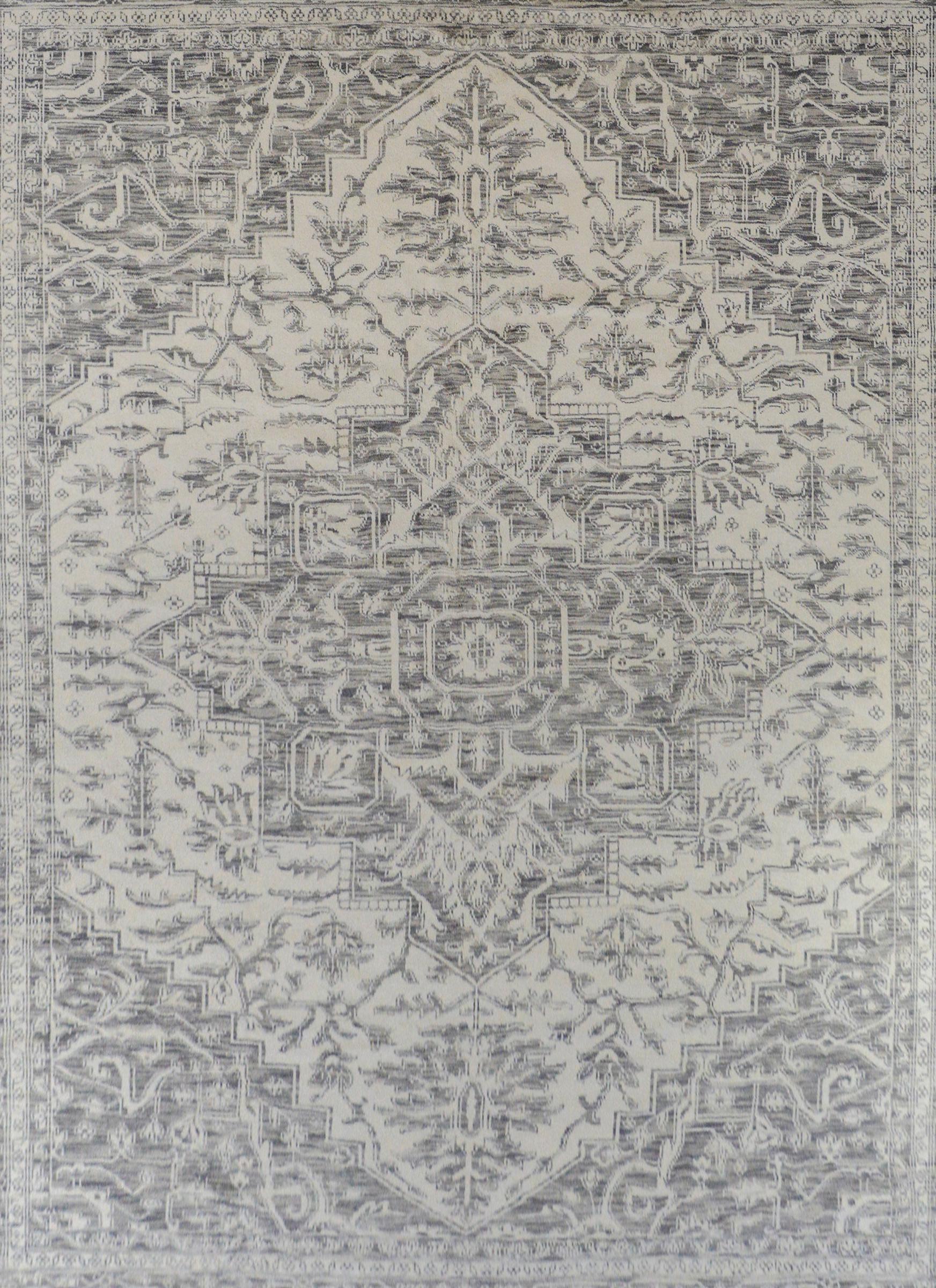 A gorgeous contemporary Indian handwoven wool rug with a traditional Persian Heriz Serapi pattern woven in various gray tones on a cream colored ground.