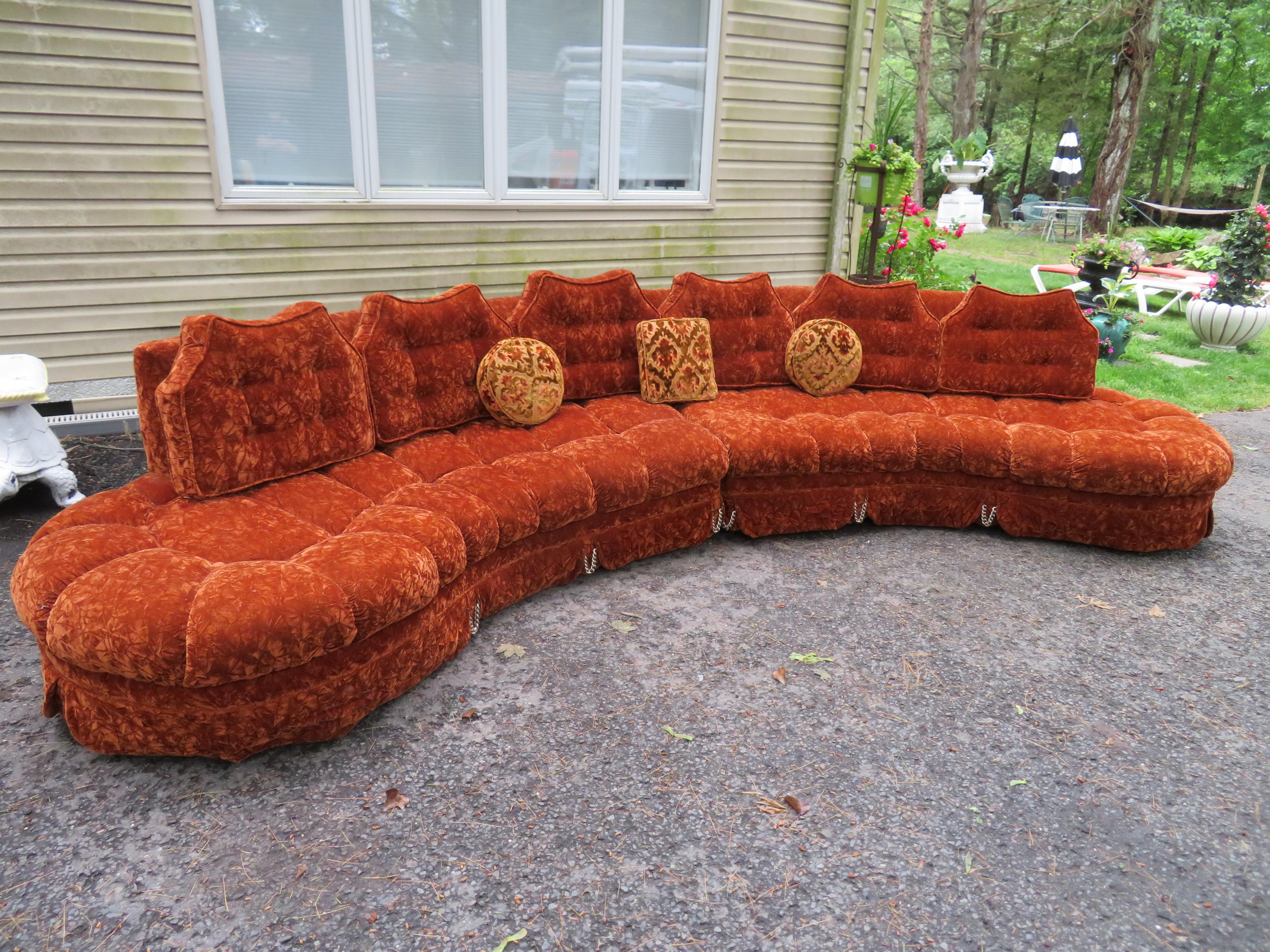 Gorgeous curved serpentine two-piece Adrian Pearsall style sofa sectional. There are no words to describe how fabulous this sofa sectional is with it's original custom tufted crushed orange velvet and amazing pleated skirt with actual chains for