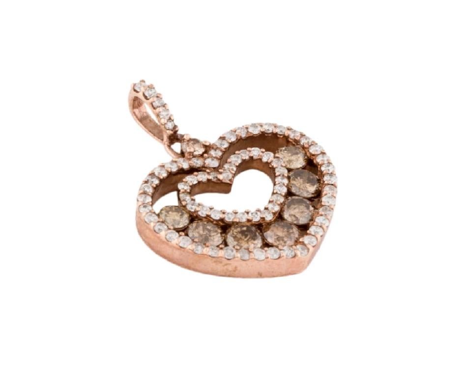 This is a beautiful sparkling white and brown diamond heart-shaped halo pendant stamped in strong 14K rose gold.
The large and striking round brilliant diamonds have great sparkle to them.

*****
Details:
►Metal: Rose Gold
►Gold Purity: