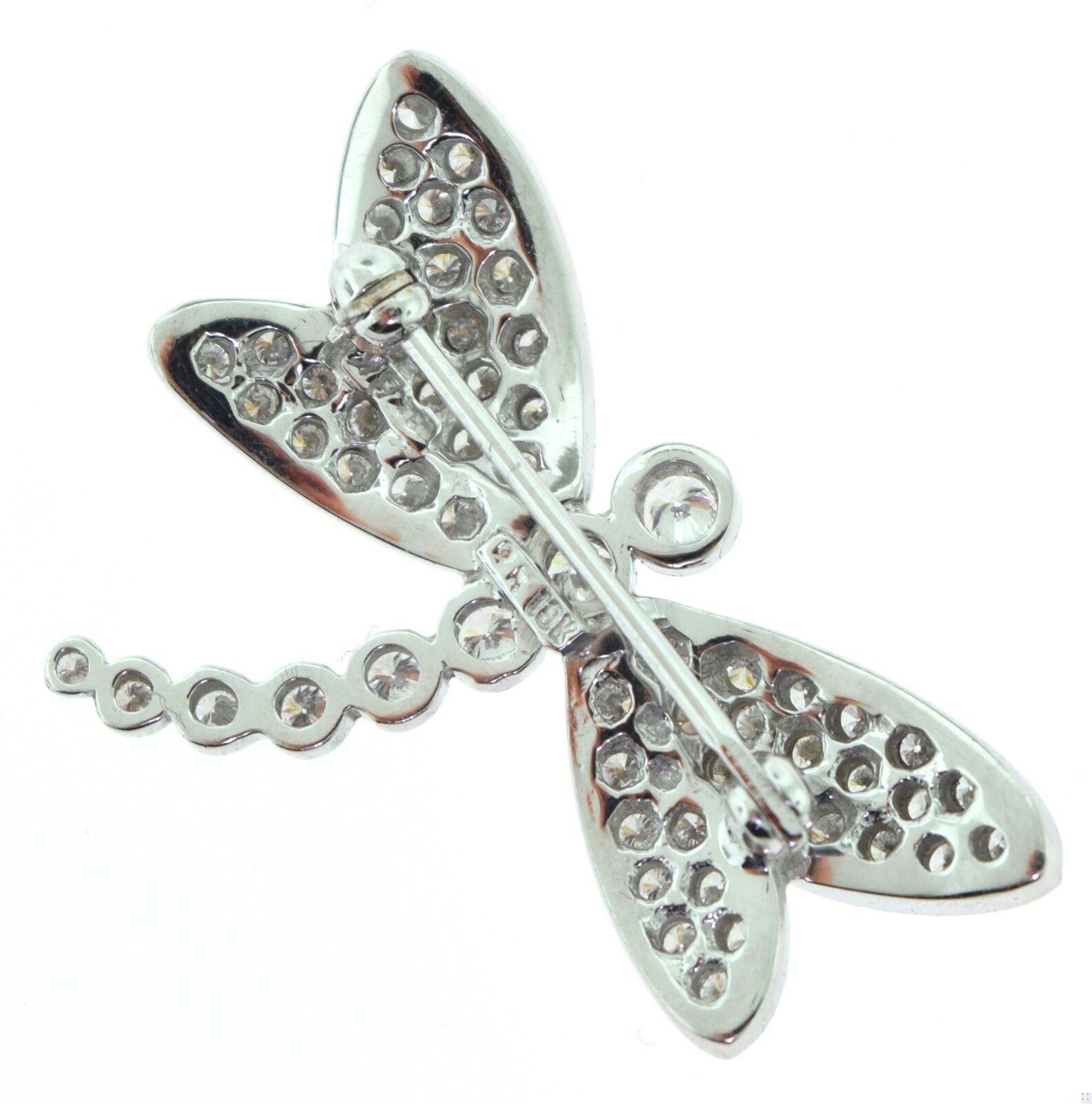 DRAGONFLY BROOCH SPECIFICATIONS:

Metal: White Gold

Metal Purity: 18k 

Stones: Diamonds

Diamond Color: G - H

Diamond Clarity: VS 

Total Carat Weight: 1.5 ct

Dragonfly Measurements: 21.17 x 28 mm

Hallmark: 18k