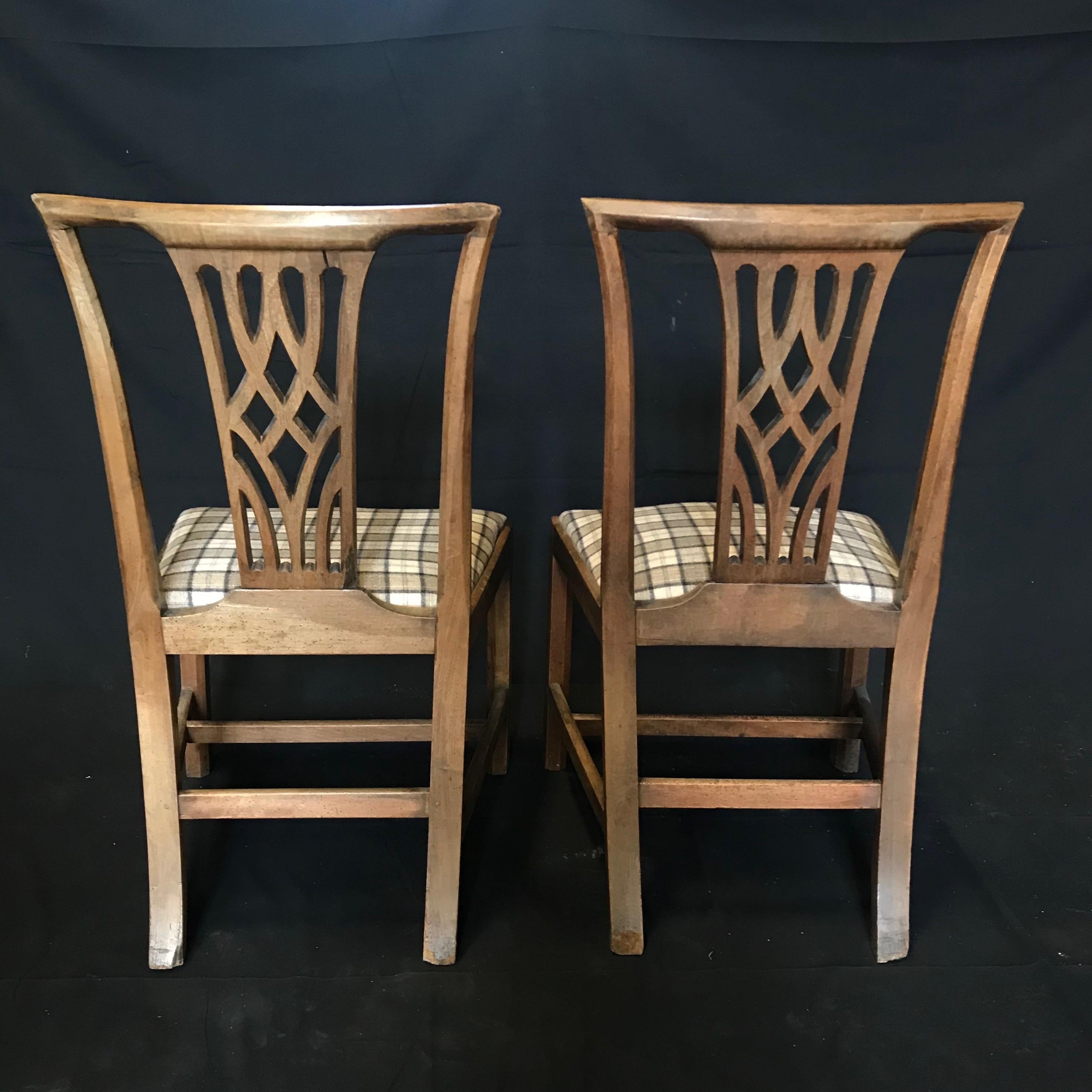 Super pair of early British oak side dining chairs circa late 18th-early 19th century with gorgeous patina, newly upholstered in complementary British tartan. Solid and early! #4575
Measures: H 38 5/8” x H seat 19” x W 21.25” x D 21.5”.