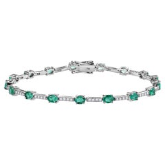 Splendido bracciale tennis con smeraldo e diamanti per la nonna in oro bianco 14k