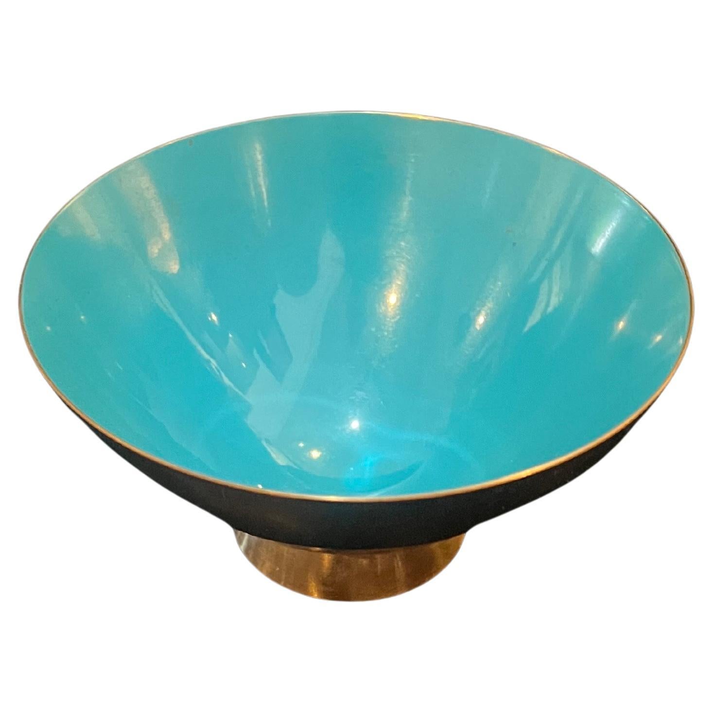 Beautiful enameled turquoise bowl with brass plated finish exterior in excellent condition no chips or cracks.