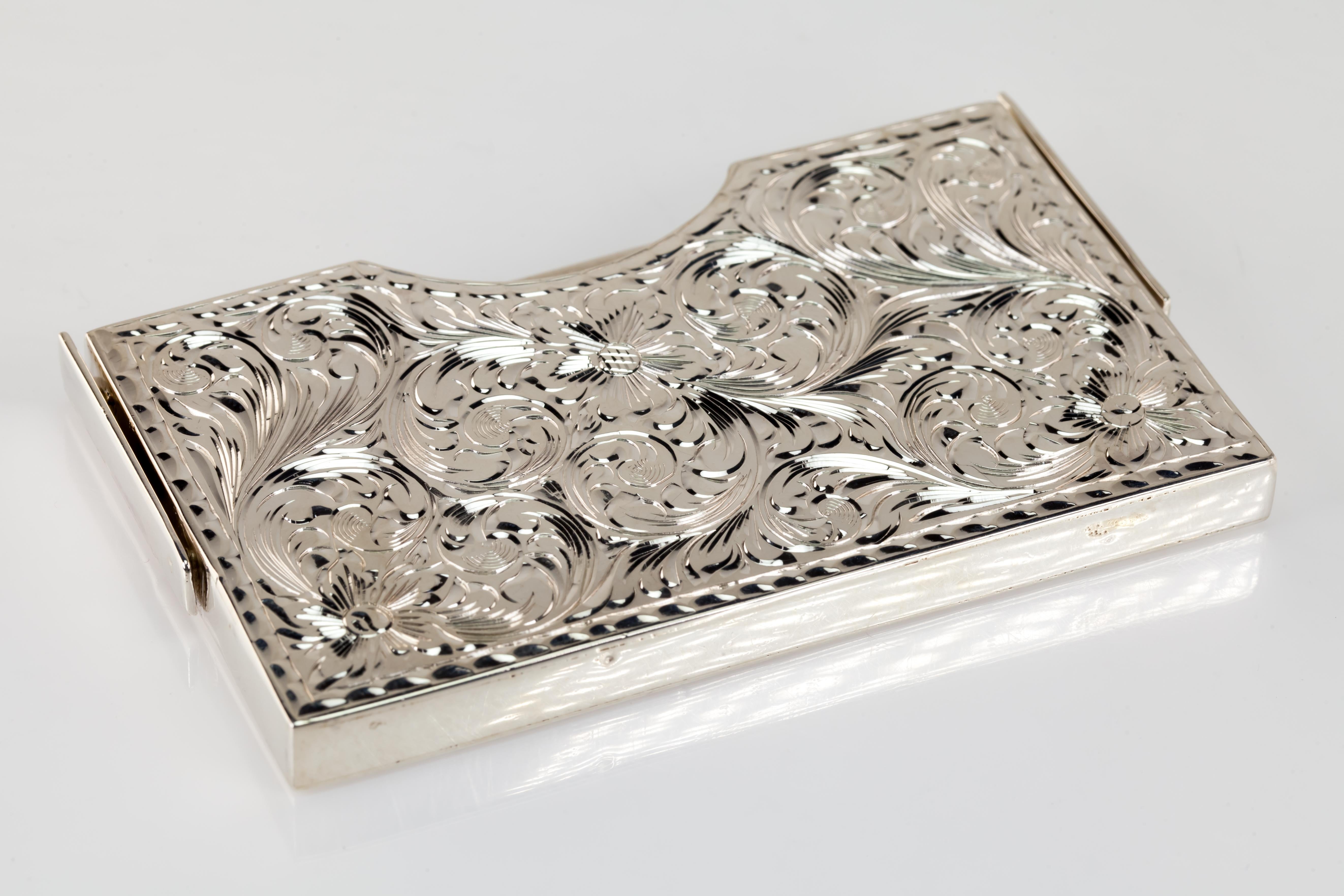 Gorgeous Etched Sterling Silver Great Seal of California Card Holder w/ Filigree

Beautiful Card Holder
Features Gorgeous Hand-Chased Etchings and Textures
Includes Great Seal of California
Total Mass = 96.5 grams
54 mm Long x 96 mm Wide x 7 mm