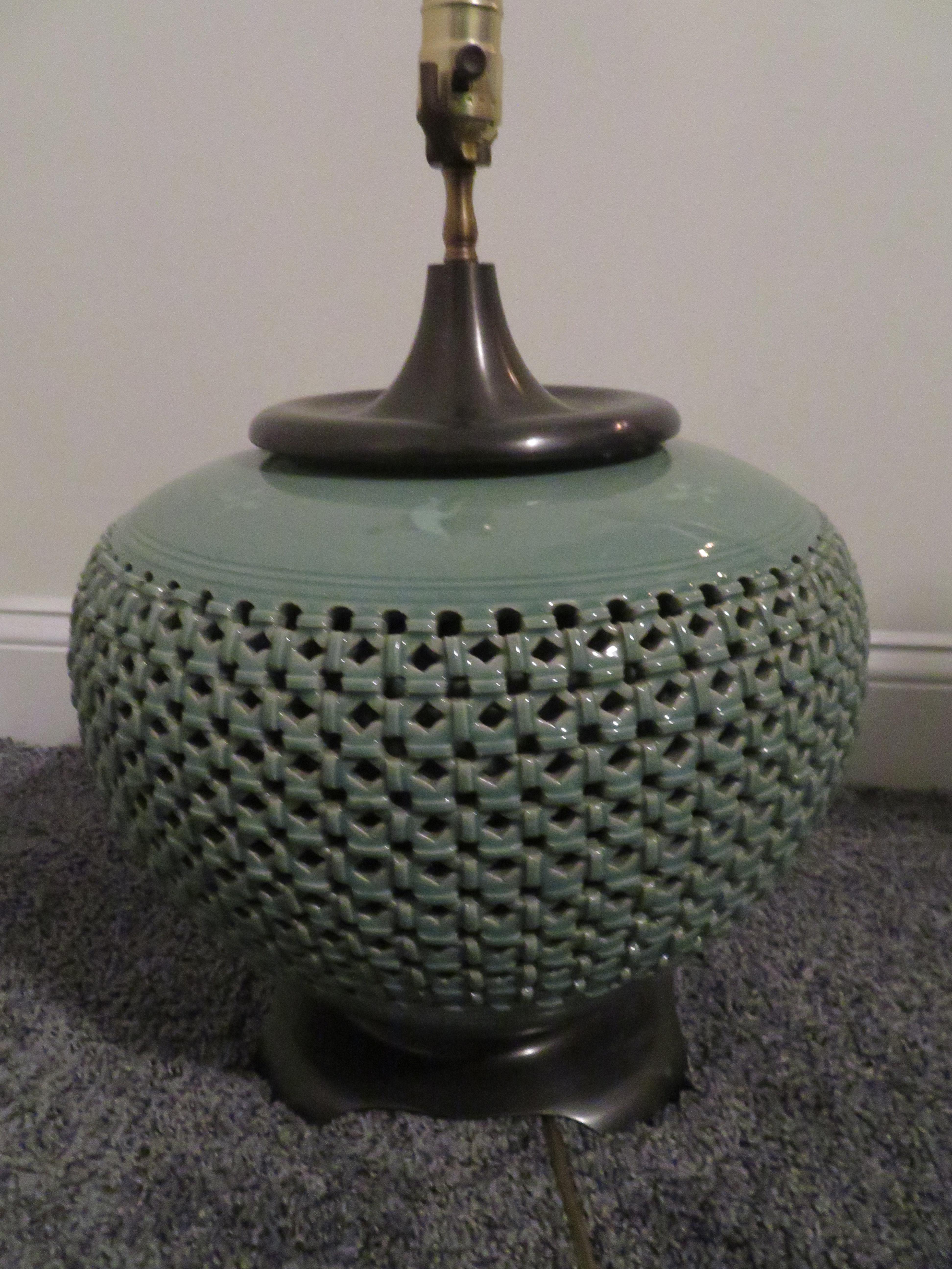 Gorgeous extra large celadon green ceramic lamp with wonderful lattice style pierced work and crackled finish to top and bottom. There are also some very light incised cranes under the crackled finish on the top half-just lovely. This lamp measures