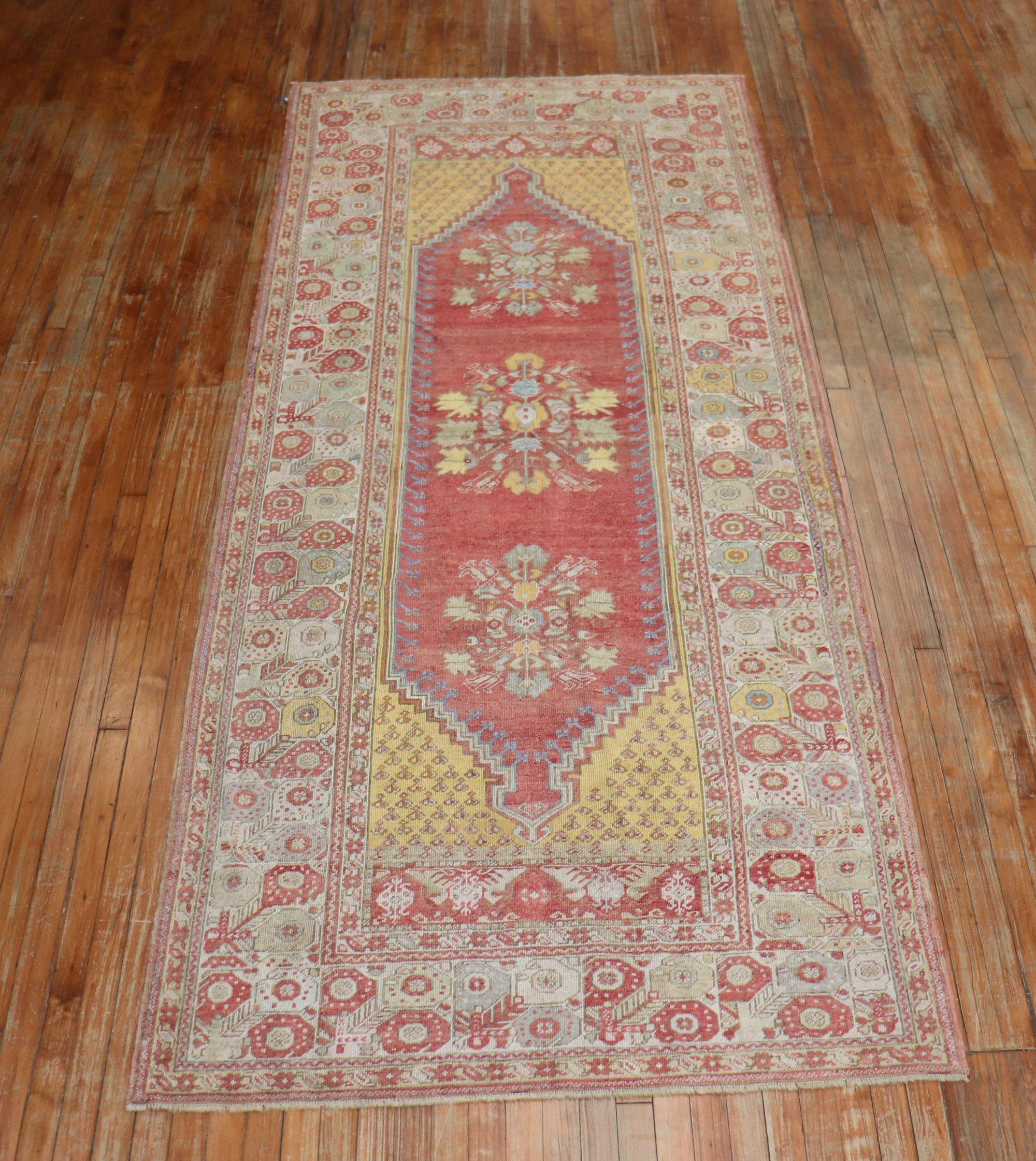 A fine quality Early 20th-century wide Turkish runner with a floral motif in warm colors

Measures: 4'5” x 10'10”.