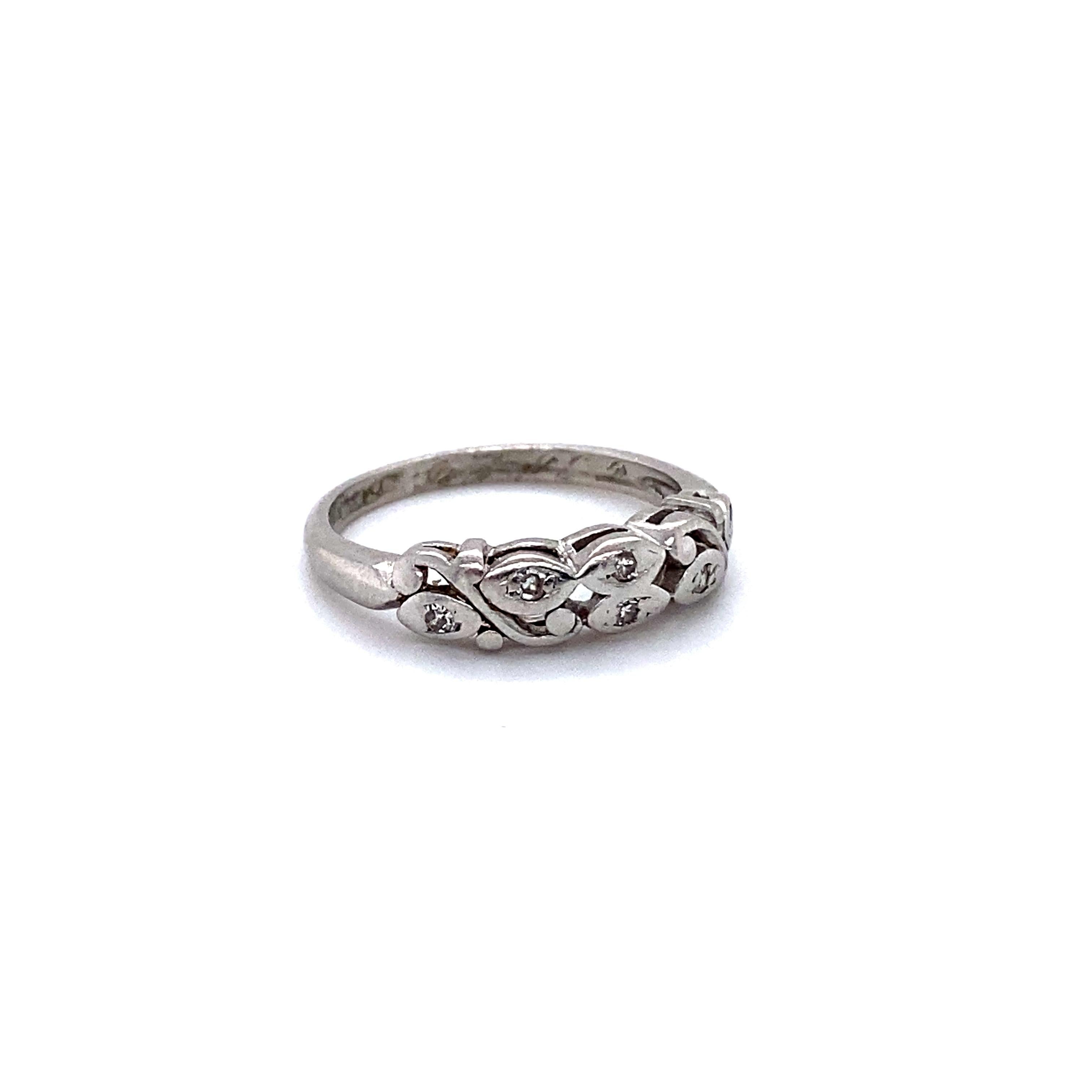 This Gorgeous Floral Vintage Wedding Band would be a fantastic compliment to any engagement ring - or be a great stand alone or stackable! Crafted in Platinum, this band features Pave Set Diamonds, with lovely scrolling floral details. There are a