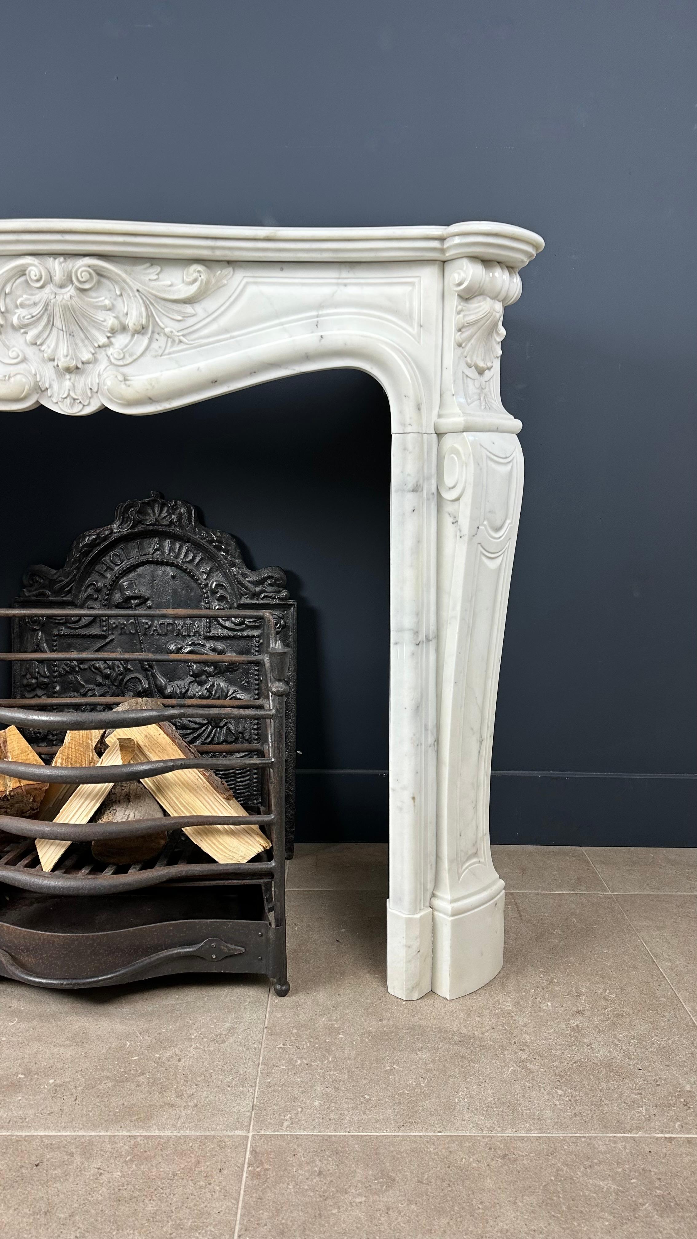 Interlace your space with the enchanting charm of our French antique shell fireplace, a masterpiece infused with history and style. Using precious Carrara marble, this fireplace offers a timeless allure and a rich sense of heritage.

The heart of