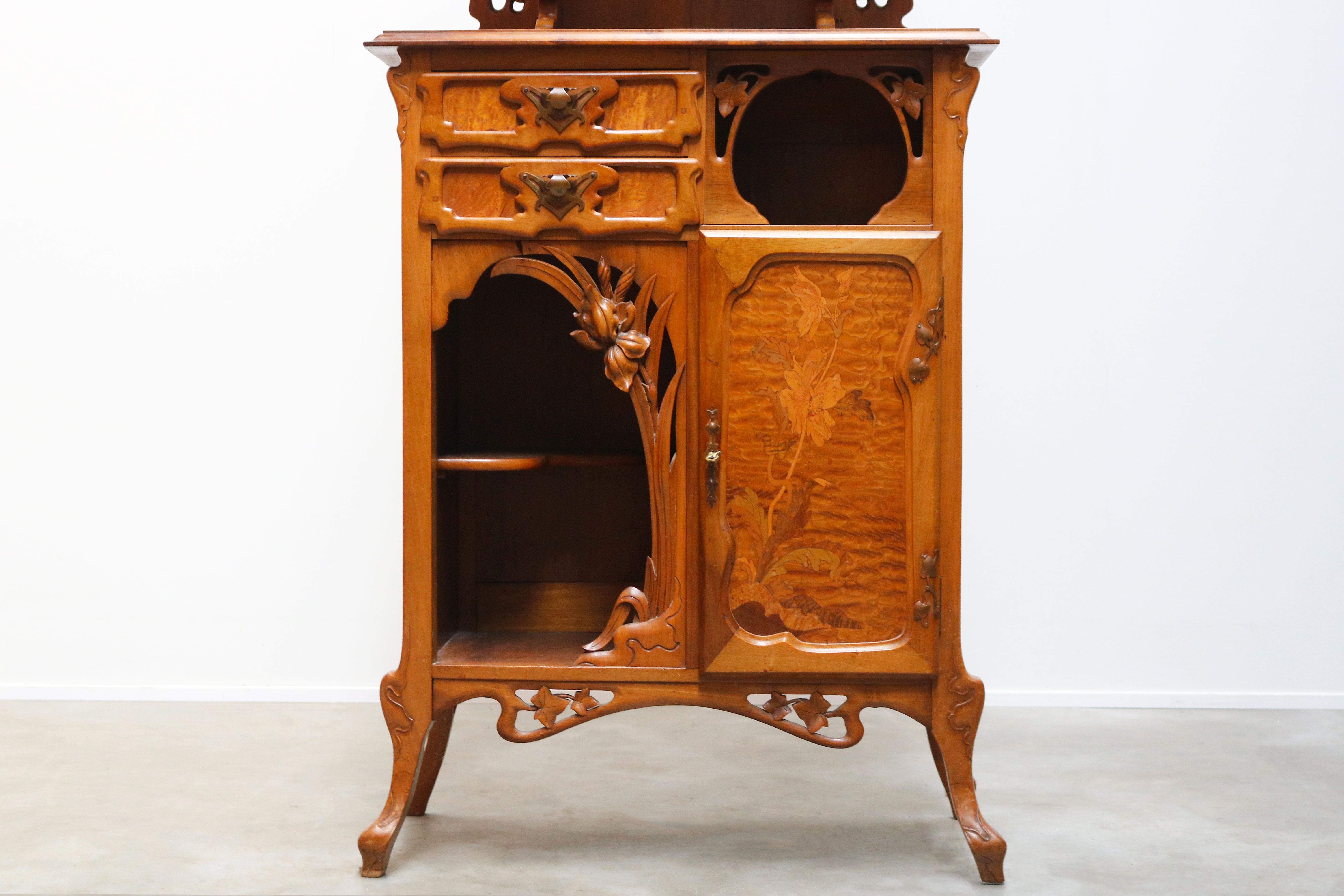 Gorgeous and most rare French Art Nouveau cabinet by Gabriel Viardot, 1890. Breathtaking floral Art Nouveau shapes with marquetry inlaid door using various kinds of wood. The cabinet has 2 drawers, 1 door and a display cabinet. Very small and