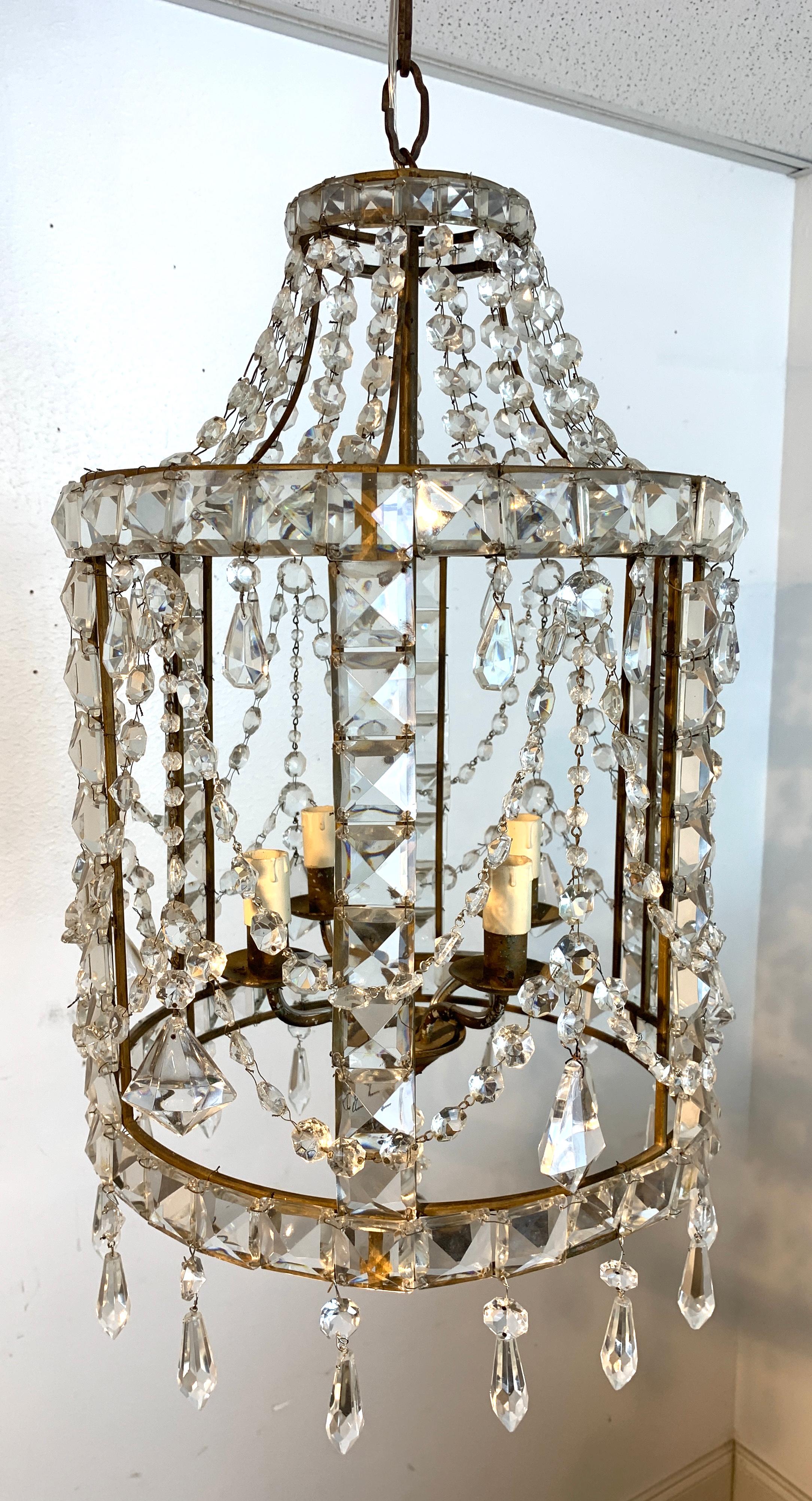 French neoclassical crystal lantern, with draps and swags of crystal, fitted with four candelabra bulbs, complete with 12
