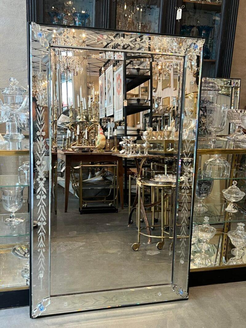 Gorgeous old Venetian mirror from France, around 1920 – 1940, with fantastic patina in the mirrored glass.

From the era, where the faceted ornaments, would elegantly reflect the light.

Beautiful floral ornamentation in the frame along the edges,