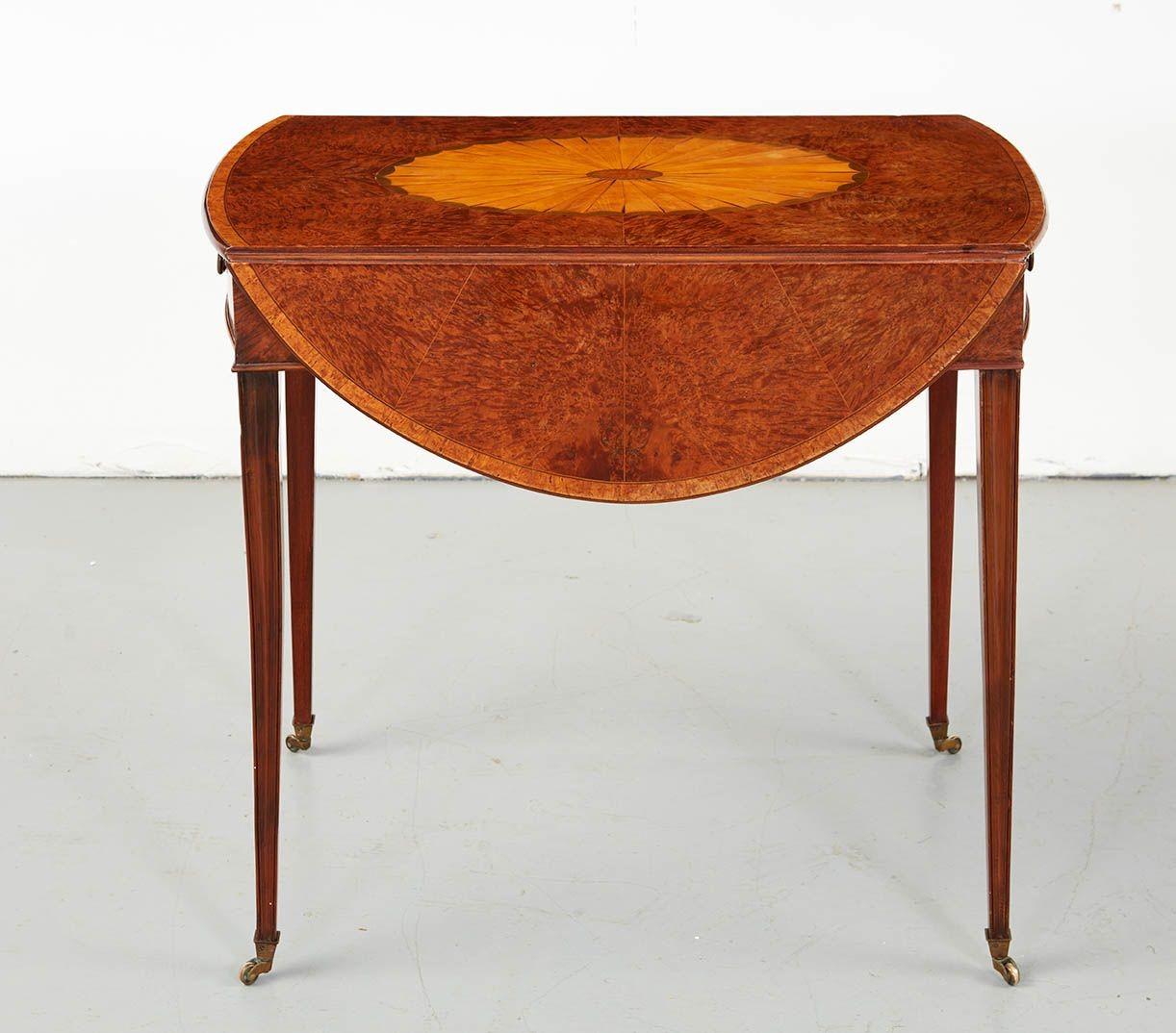 Very fine George III burr Yewwood Pembroke table, the oval top with central satinwood and harewood patera, on book-matched, segmented burr yew ground with satinwood banded edgel over single drawer retaining original brass pull and standing on molded