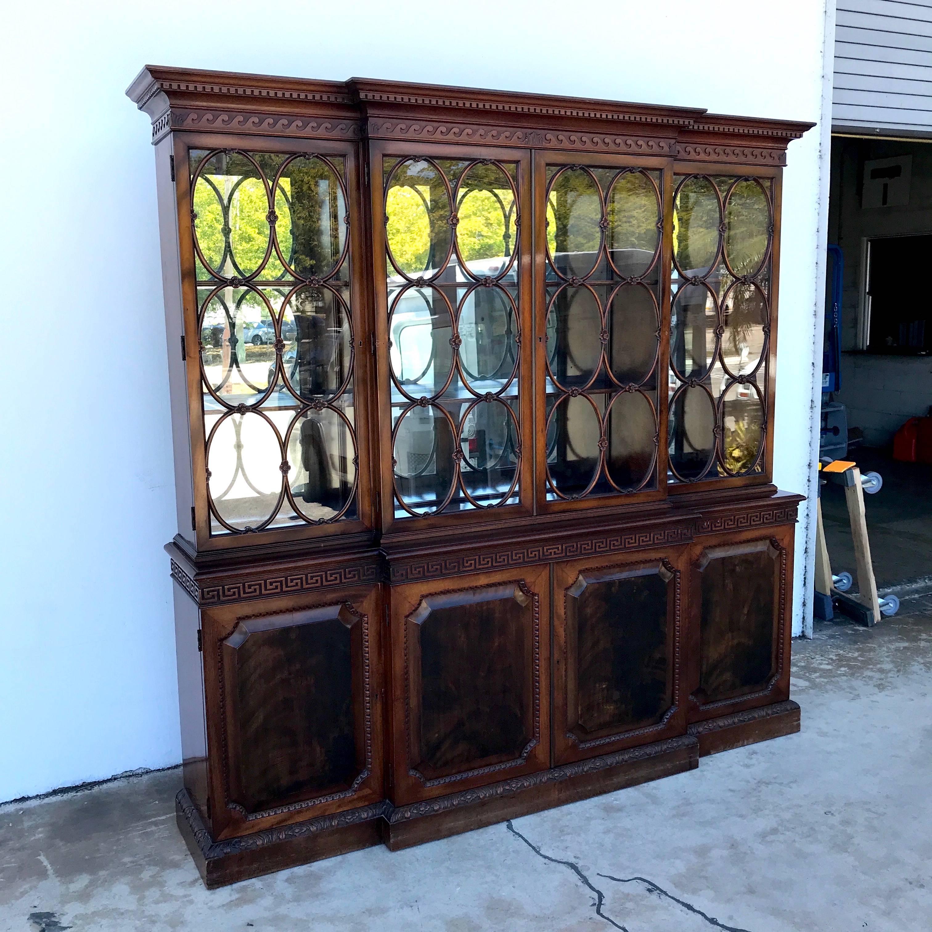 Gorgeous Georgian style mahogany breakfront, in two parts, the mirrored upper case fitted with four doors (two side doors are 19