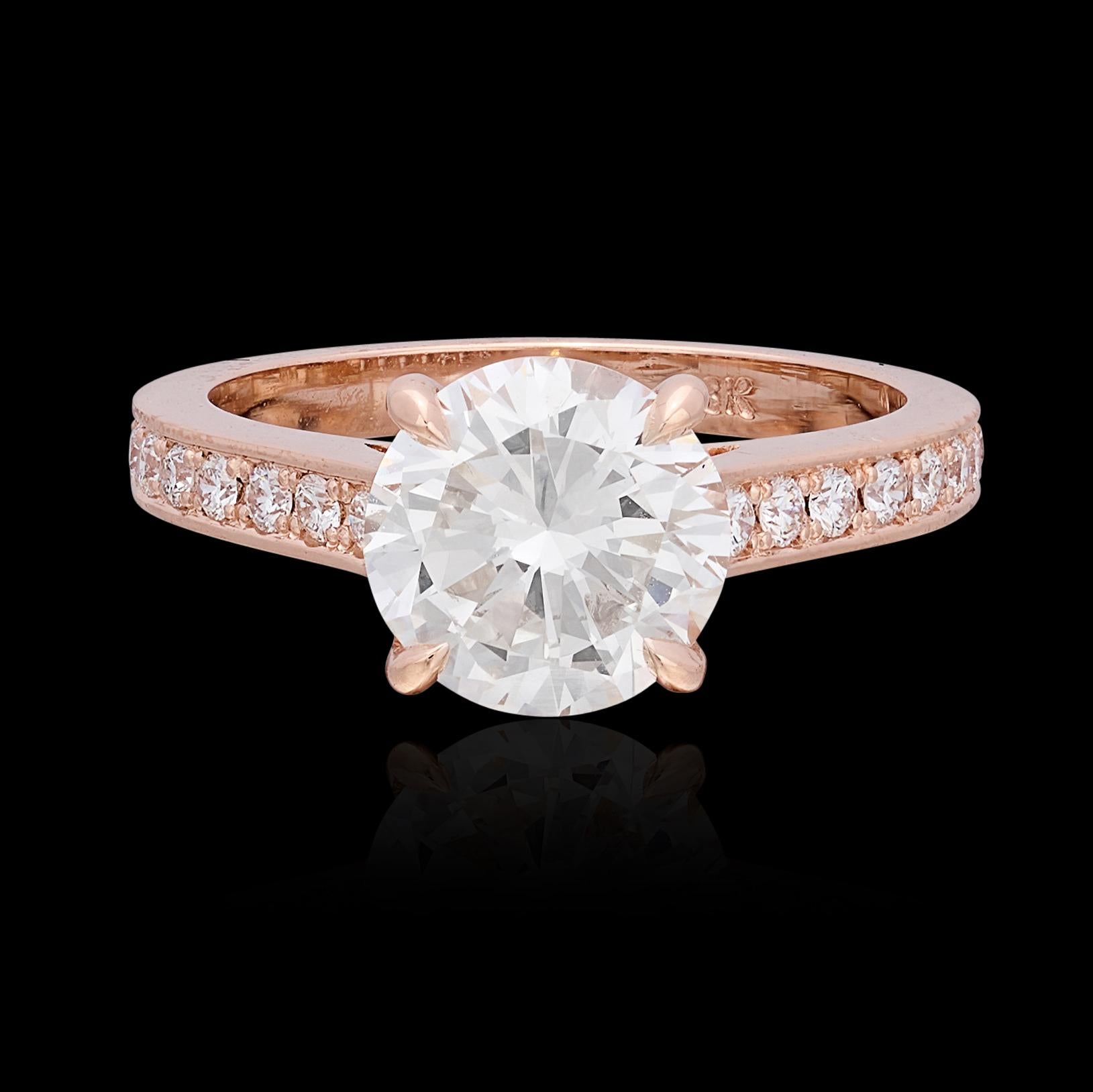 A classic beauty featuring an incredible center stone. This 18 karat rose gold stunner centers on a 2.22 carat round brilliant cut diamond with sparkle and fire to spare! The center stone has been graded by The Gemological Institute of America as