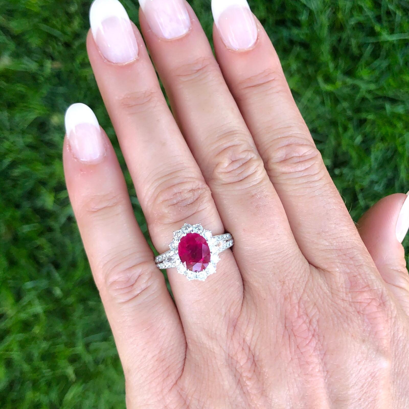 Burmese rubies are sought after for their beautiful red tones. This 18k white gold ring featuring a 3.06 carat oval-shaped ruby is a great example of the Burmese allure - deep red tones with the slightest hint of pink. Flanked by fancy-cut diamonds
