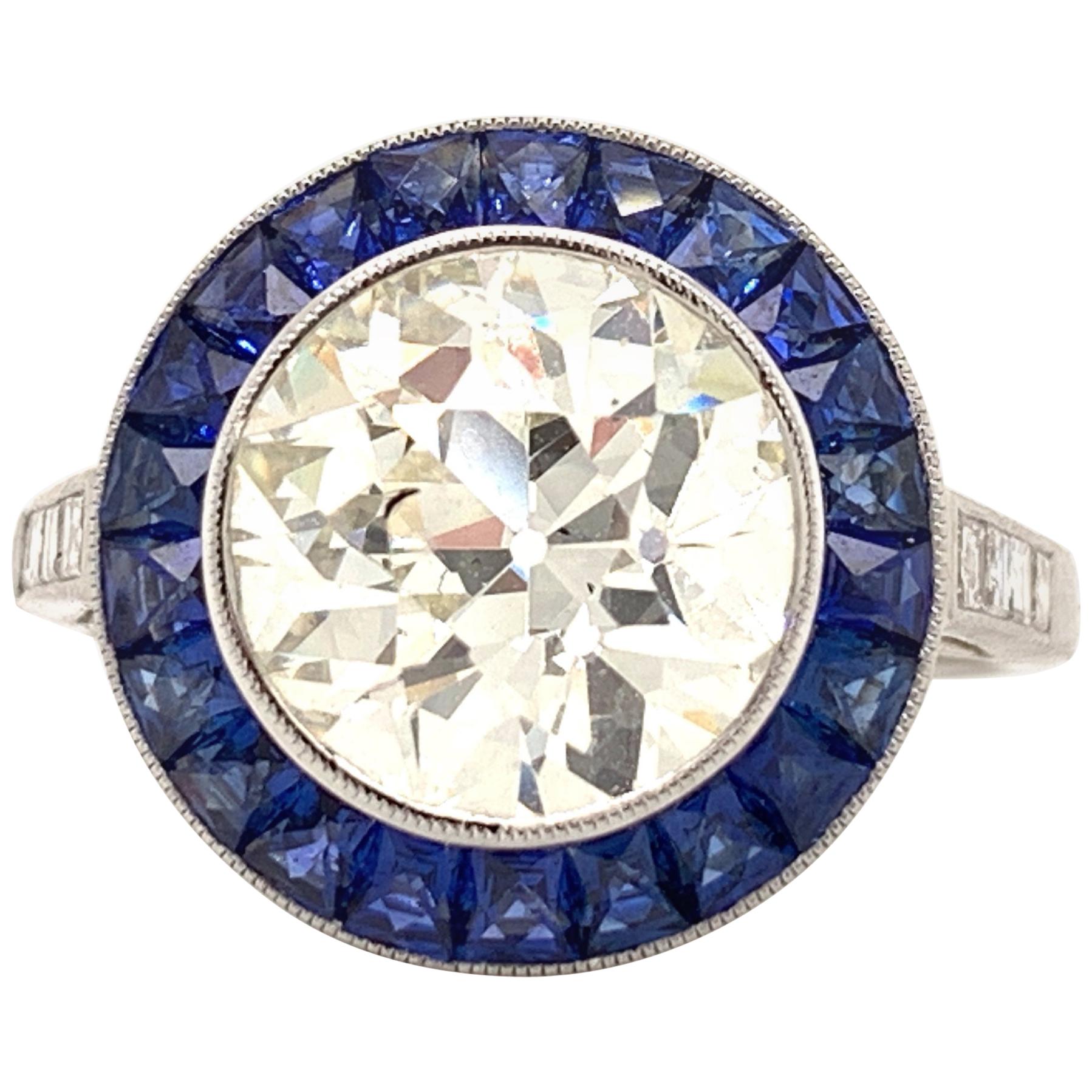 Bague Sophia en platine avec diamant central de 3,04 carats et saphir bleu certifié par le GIA