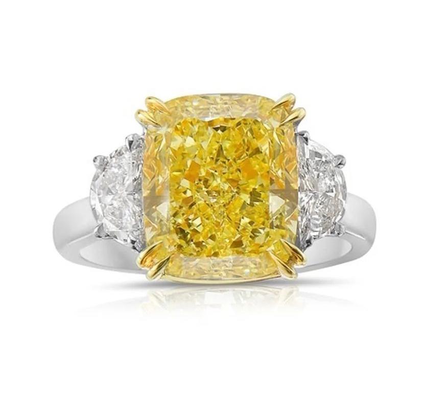 An exclusive and stunning GIA certified fancy intense yellow diamond on spectacular ring ,with a exquisite design , very adorable piece.
Ring come in 18k gold with a GIA certified natural fancy intense yellow diamond of 6,00 carats, cushion cut, VS2