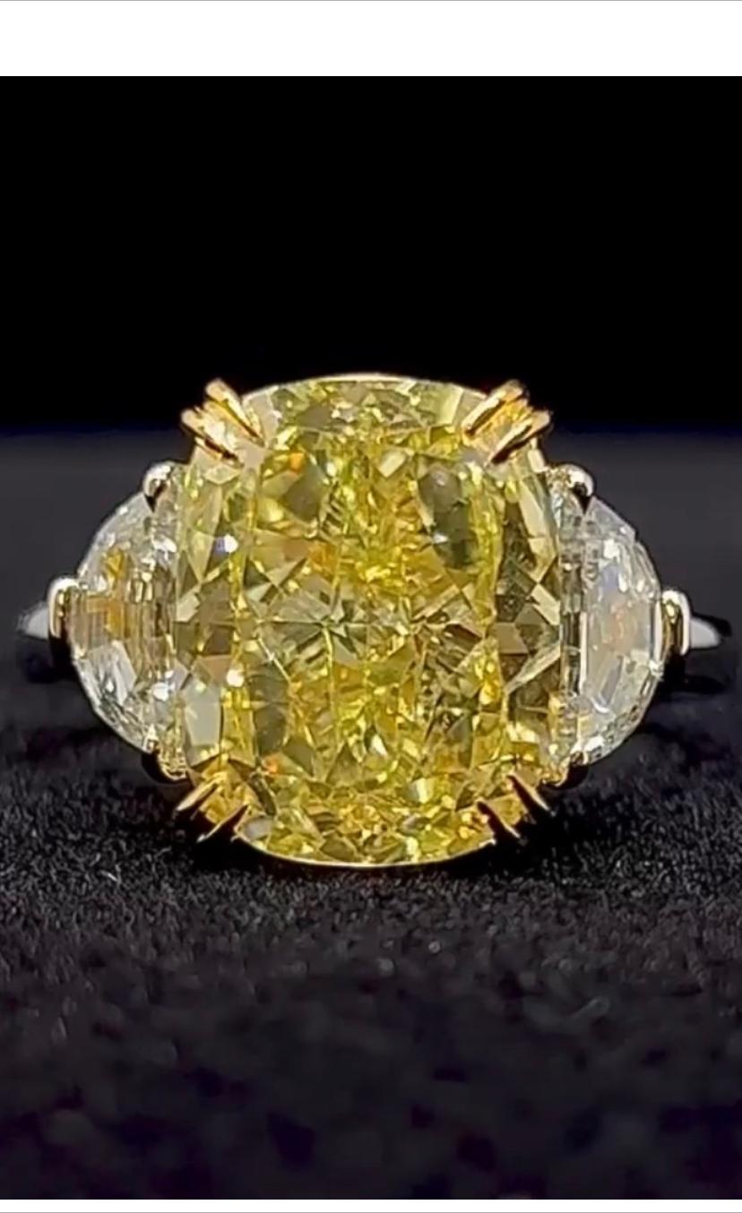 So stunning and chic design for this rare and  amazing ring with a incredible natural fancy yellow diamond , cushion cut, 11,29 ct , clarity VS1, and two side diamonds, special cut, top quality.
It is a investment stone. 
Complete with GIA