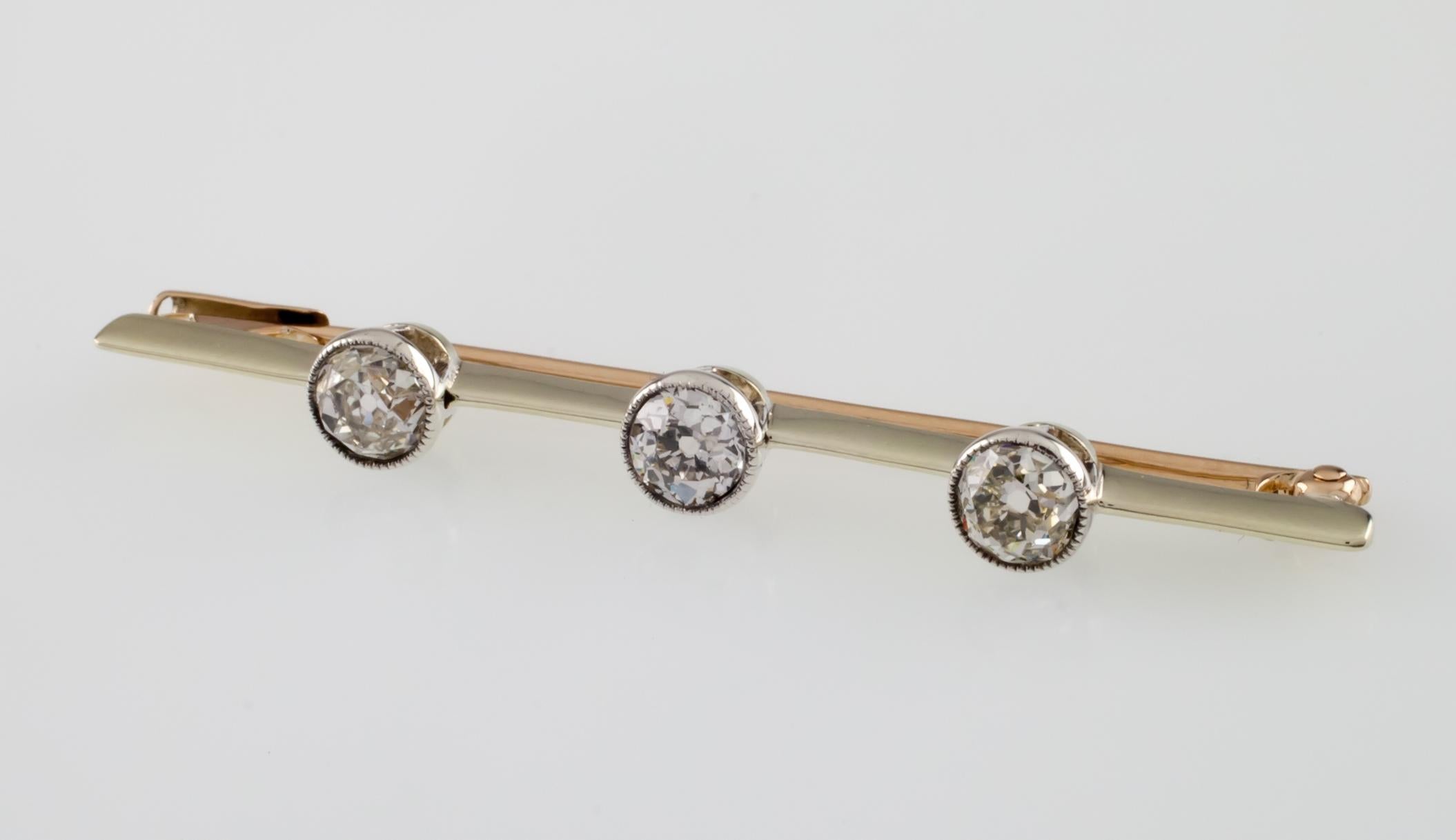 Gorgeous Gold Brooch
Features Three Bezel-Set Old Miner's Cut Diamonds
Total Diamond Weight = 0.75 ct
Total Length of Brooch = 48 mm
Total Mass = 2.9 grams
Gorgeous, Elegant Brooch!