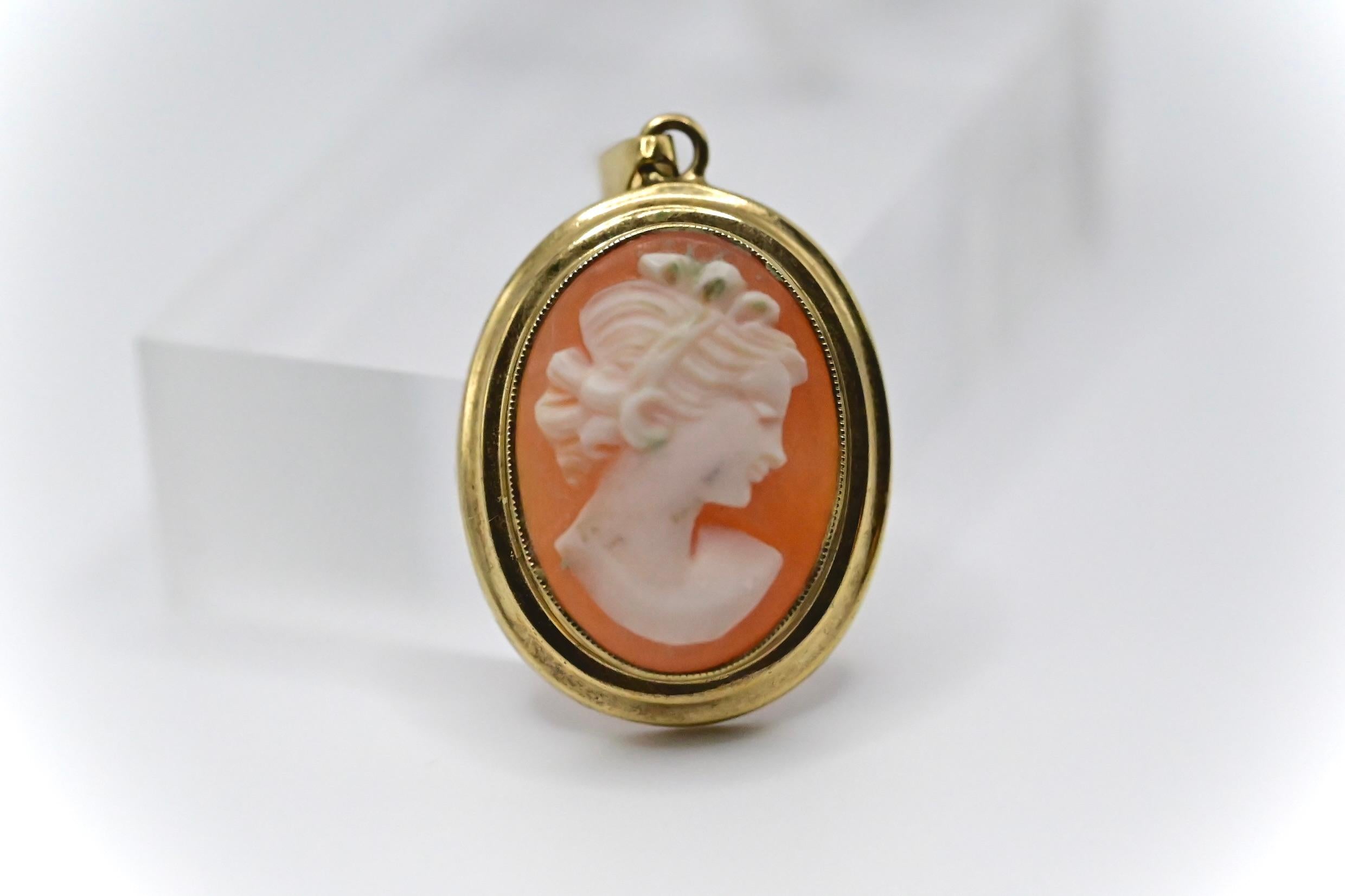 This is a beautiful gold carved shell cameo necklace pendant. It weighs about 3 grams, it’s 12/16 inches in diameter, and it stands at 1 and 5/16 inches tall. It’s in good condition, and if you have any questions or concerns about the item, please