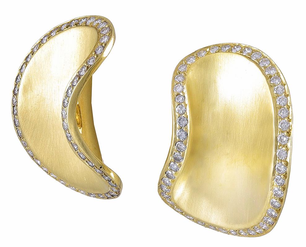 Graceful statement earrings.  Made and signed by ANGELA CUMMINGS.  18K textured gold.  The softly curved borders are set 
with brilliant diamonds. Omega clip closure. The earring are left and right, so they frame the face beautifully.  1