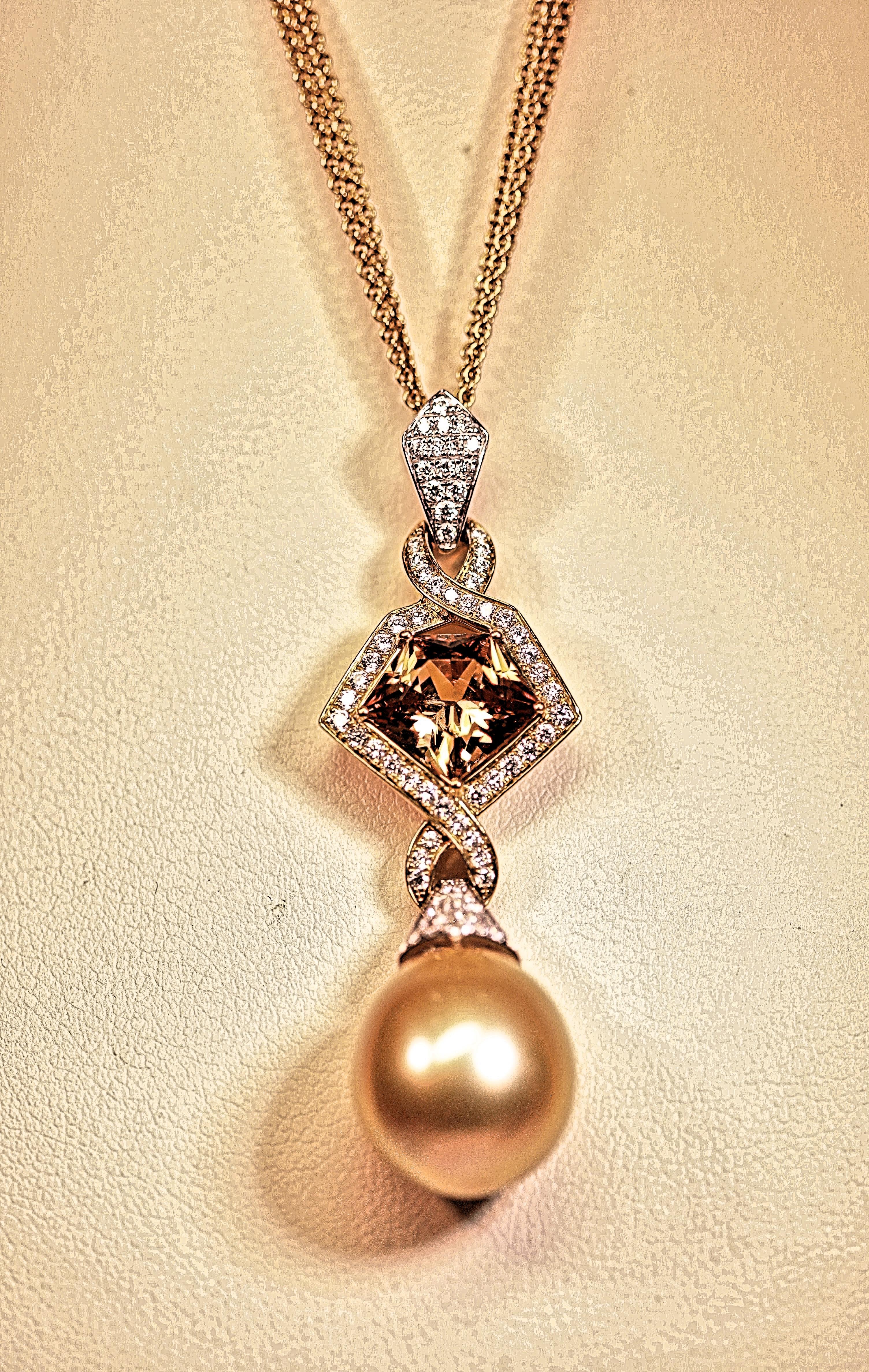 The pendant has a gorgeous golden South Sea pearl, diamonds and a golden fancy cut zircon. The South Sea golden pearl measures 15mm by 13mm. The pearl has excellent luster and minor blemishes. The pendant has one pentagon shaped golden zircon that