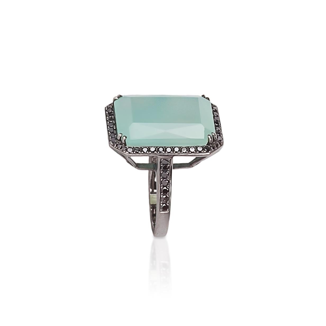 Gorgeous combination of green (emerald-cut) chalcedony (measures 20x15mm) and 52 brilliant-cut black diamonds appropriately weighing 1cts, 14k white gold(approximately 11 grams) dipped in black rhodium.  Stamped 14k and DLS.