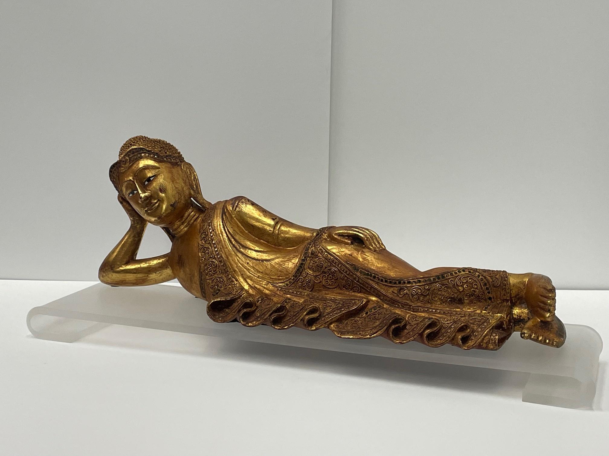 Indonesian Gorgeous Hand Carved Giltwood Reclining Buddha on Custom Lucite Base For Sale