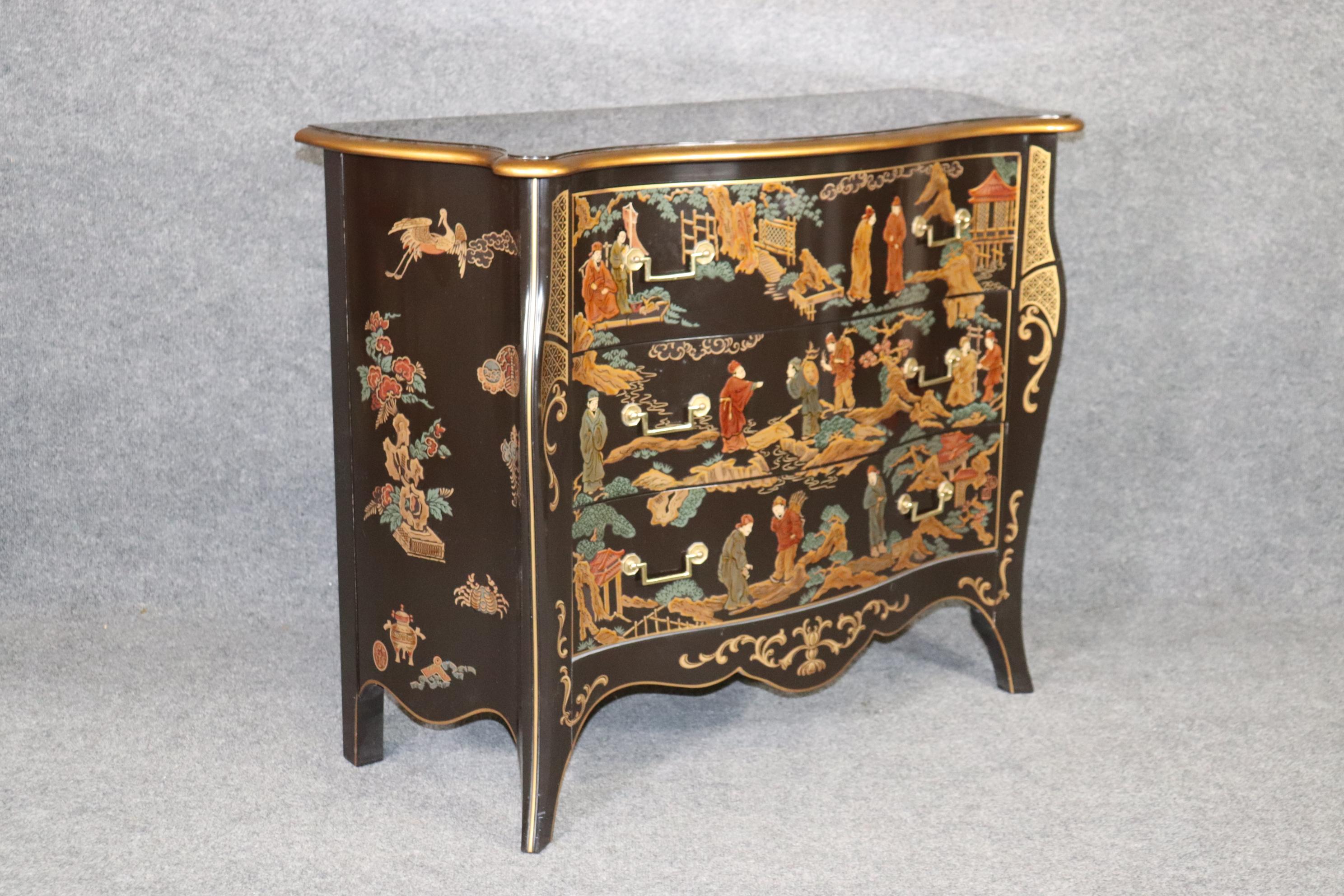 This is a gorgeous chinoiserie paint decorated commode by Drexel furniture from the Et Cetera collection. The chinoiserie decoration ia hand-painted and features scenes of people gathering and being social. The commode is in good used condition and