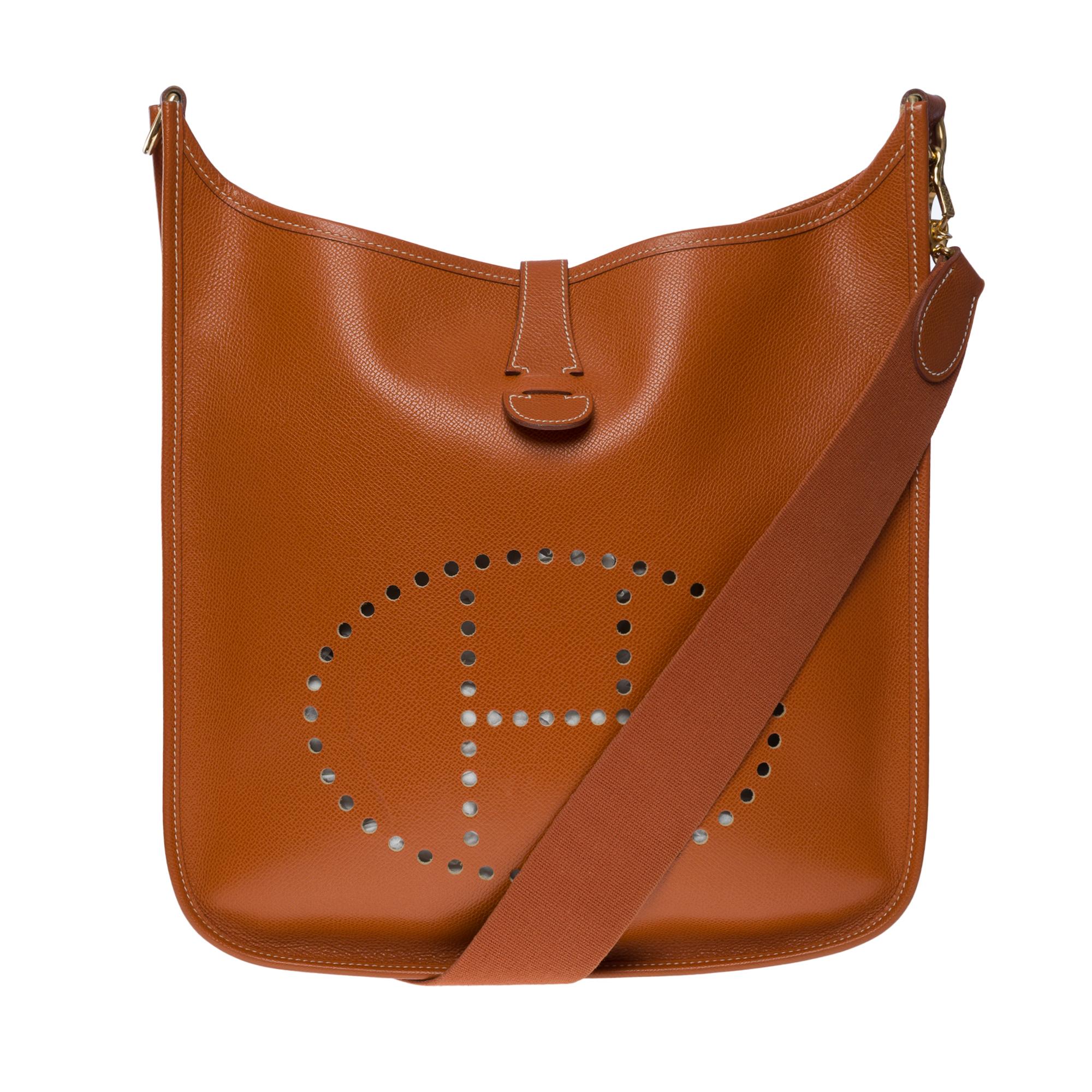 The Iconic Hermes Evelyne 33 (Grand Modèle) shoulder bag in Camel Epsom leather, gold metal hardware, a removable shoulder strap in camel canvas for a shoulder or crossbody carry

Snap closure on flap
Red suede interior
Signature: 