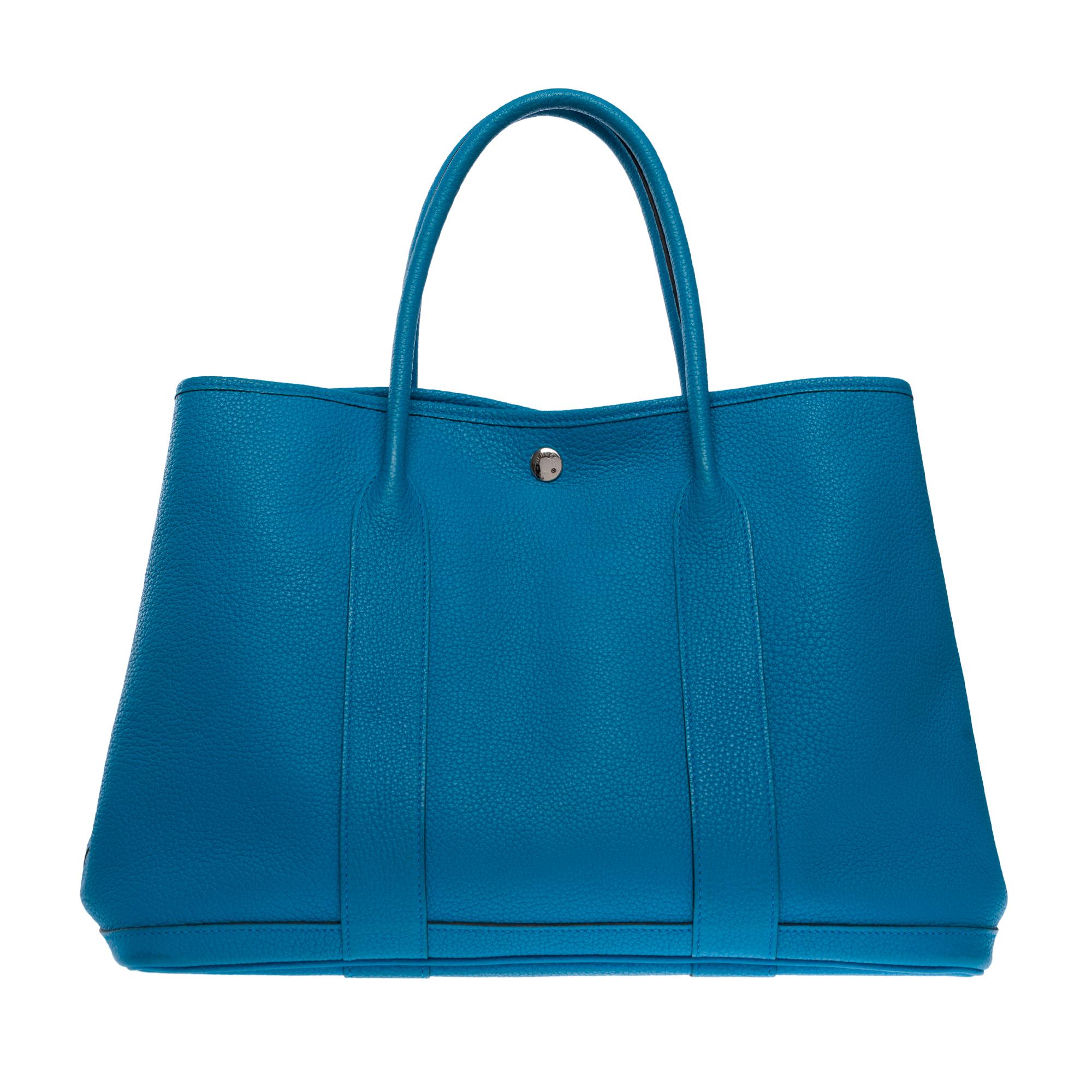 Beautiful Hermes Garden party 36 Tote bag in Blue Zanzibar Negonda calf leather , double handle in blue leather for a hand or shoulder carry

Snap fasteners patterned saddle studs in silver metal 
Beige canvas interior
Signature: 