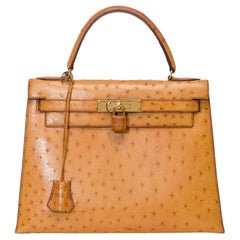 Wunderschöne Hermès Kelly 28 sellier Handtasche in Straußengold Leder, GHW