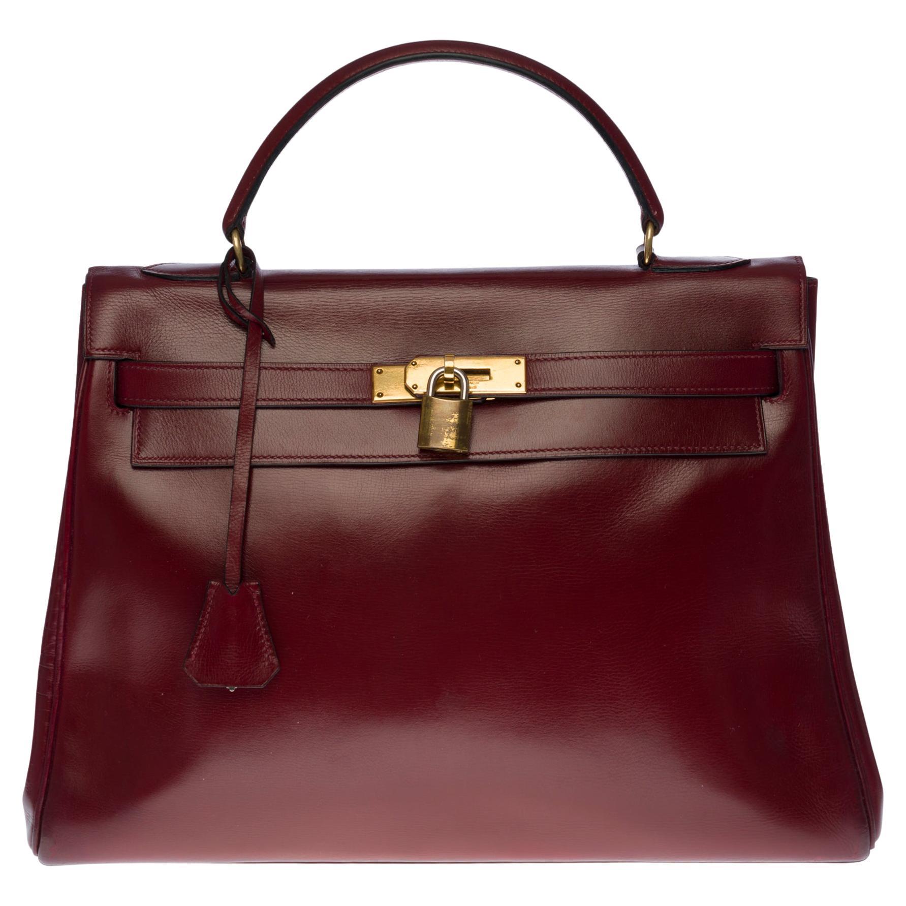 Gorgeous Hermès Kelly 32 handbag in Burgundy Calf leather, GHW