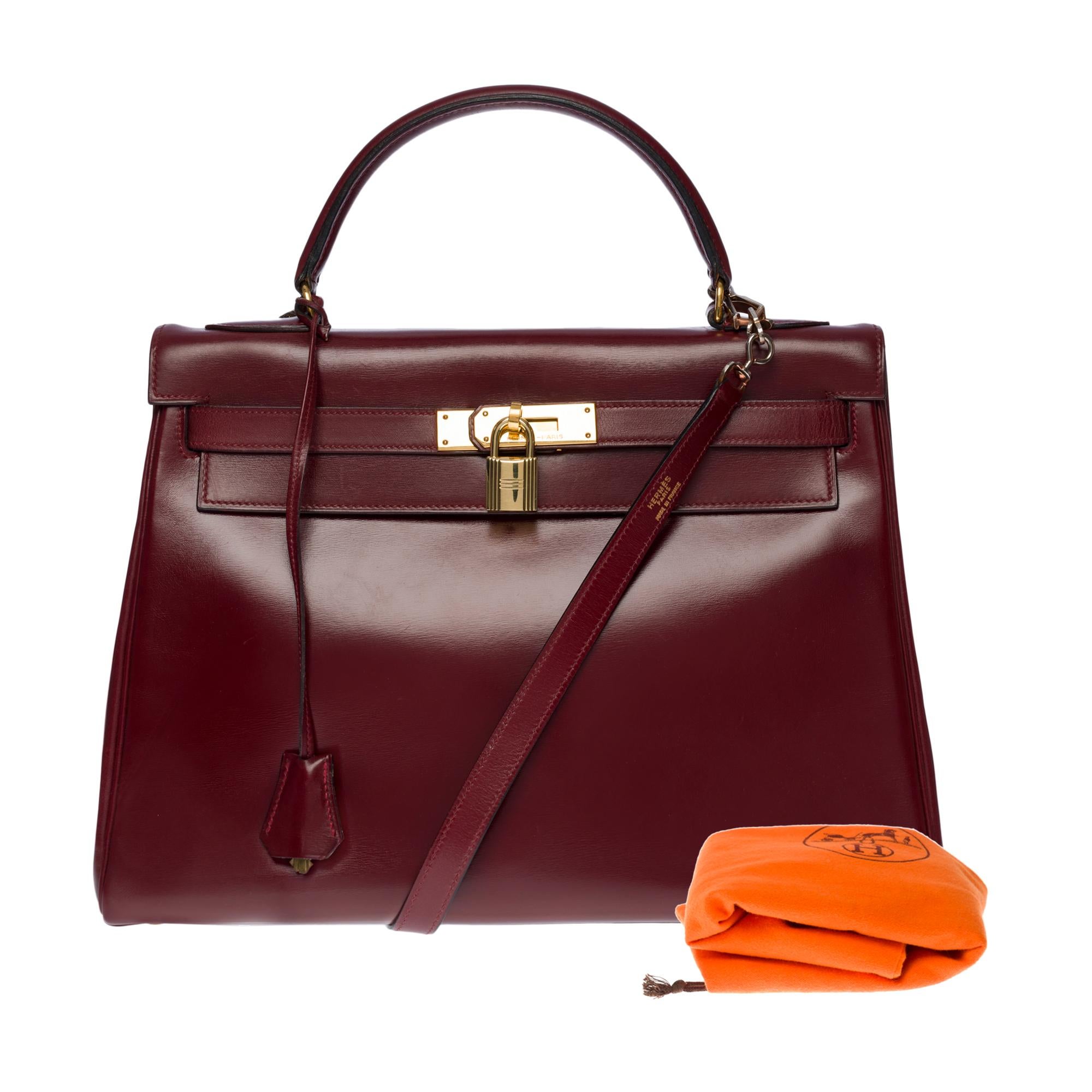 Gorgeous Hermès Kelly 32 retourne handbag strap in Burgundy Calf box leather, GHW 3