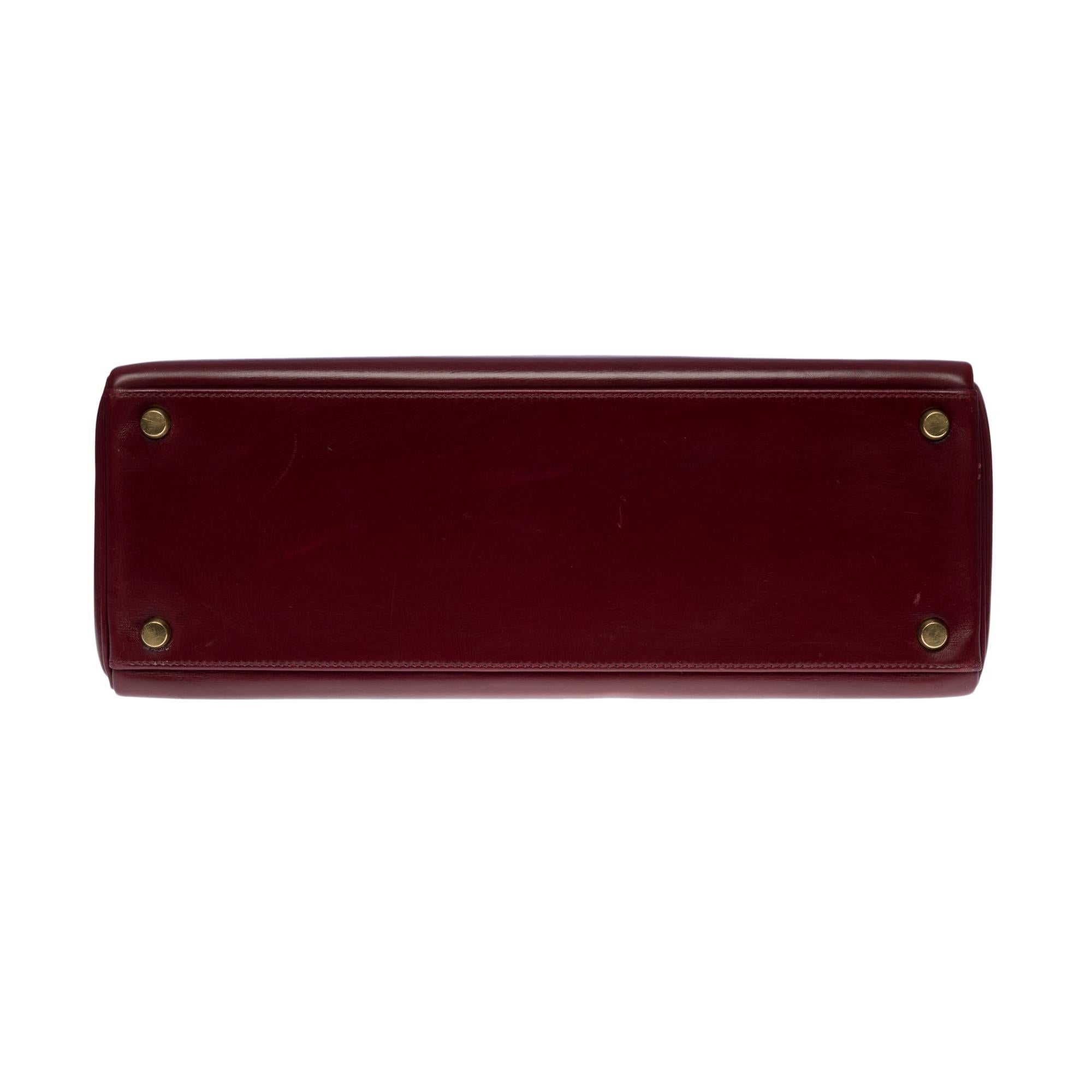 Gorgeous Hermès Kelly 32 retourne handbag strap in Burgundy Calf box leather, GHW 1