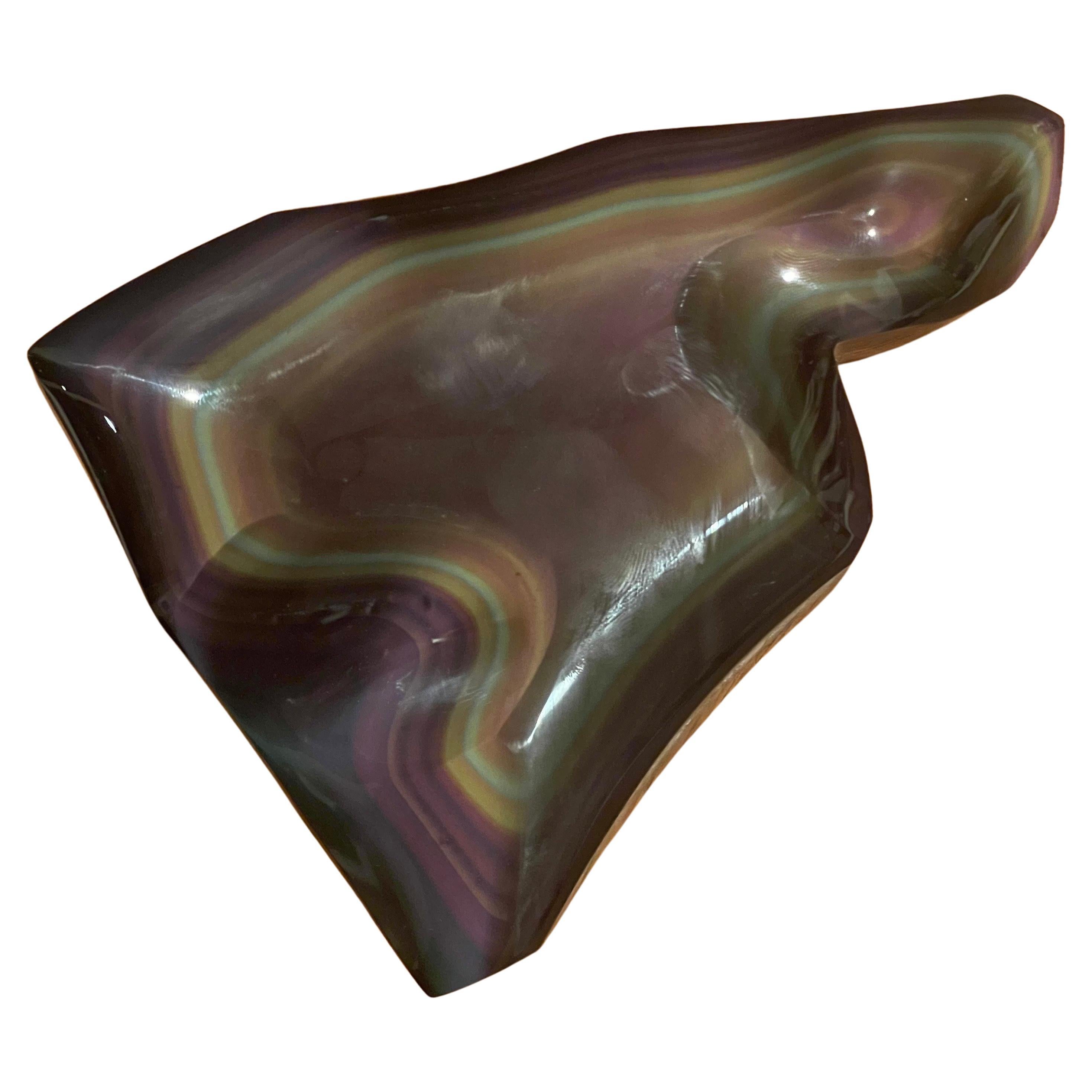 A gorgeous highly polished rainbow obsidian paperweight, circa 1960s. The piece is in very good condition with wonderful colors and measures 6.25