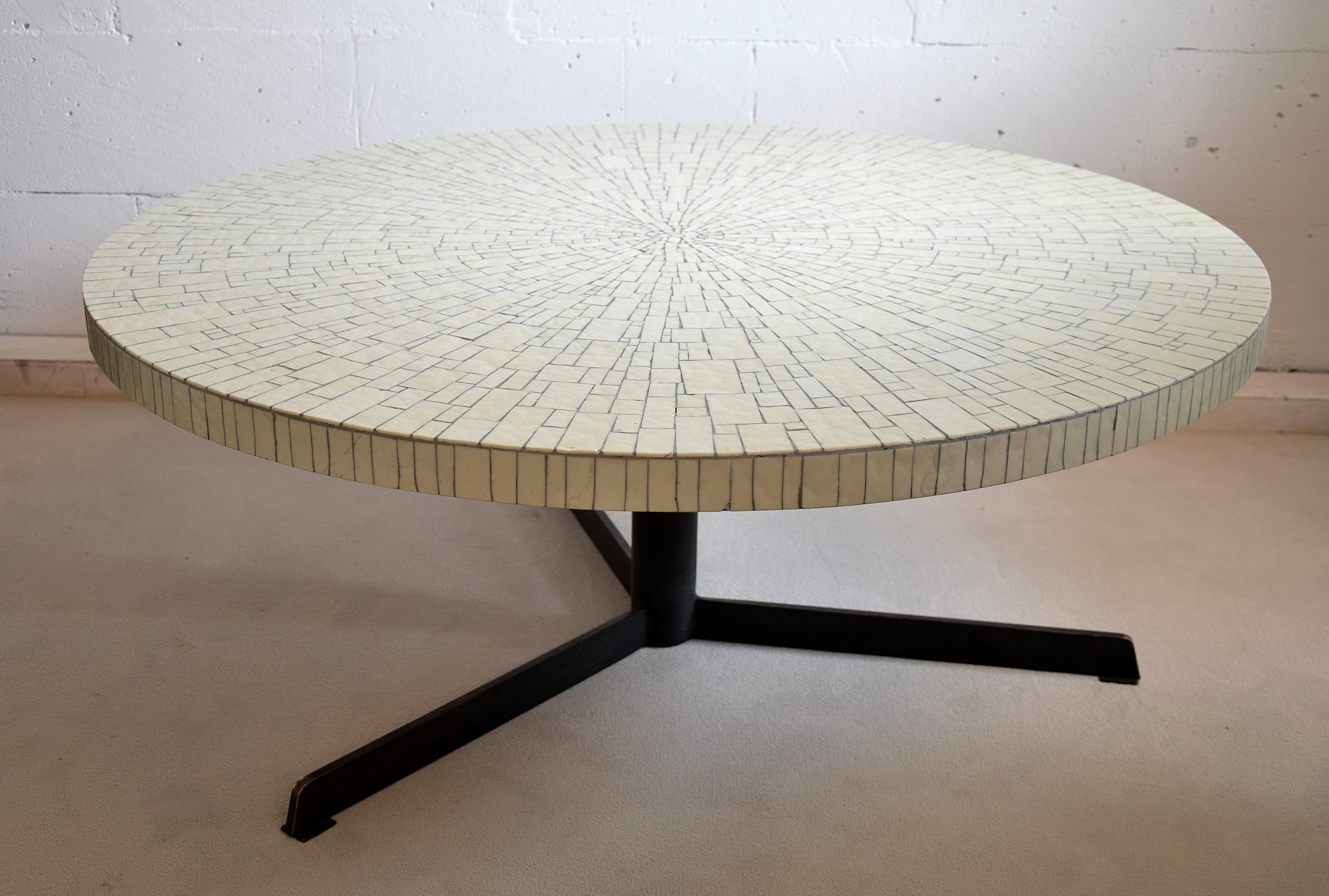 Beautiful and stylish 1960s round white glass mosaic coffee table by Heinz Lilienthal.
The table will be shipped insured overseas in a custom made wooden crate. Cost of transport is crate included.
Lilienthal went into business for himself and