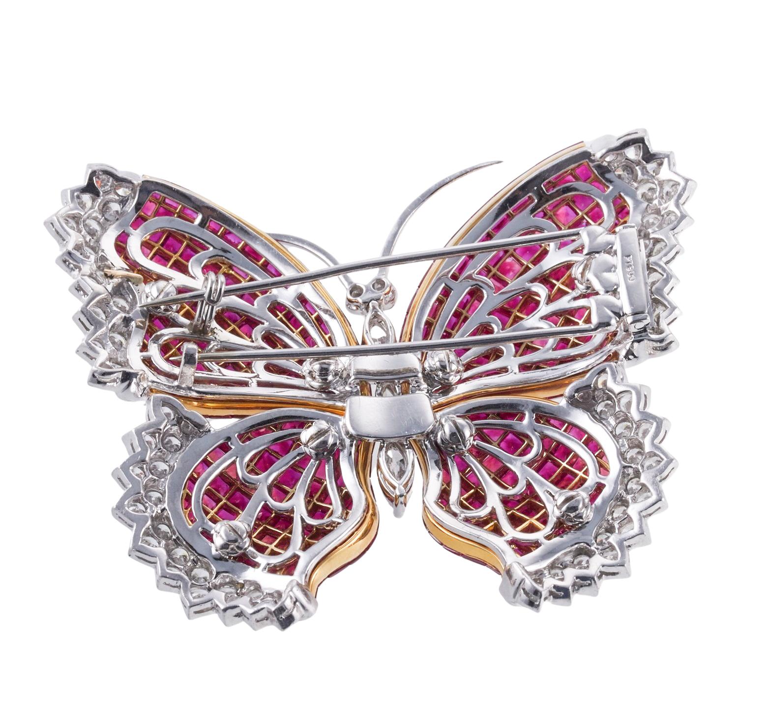 Beautiful and intricate butterfly brooch, set in platinum and 18k gold, featuring invisible set vibrant rubies and approx. 4.40ctw G-H/VS diamonds. Brooch measures 2