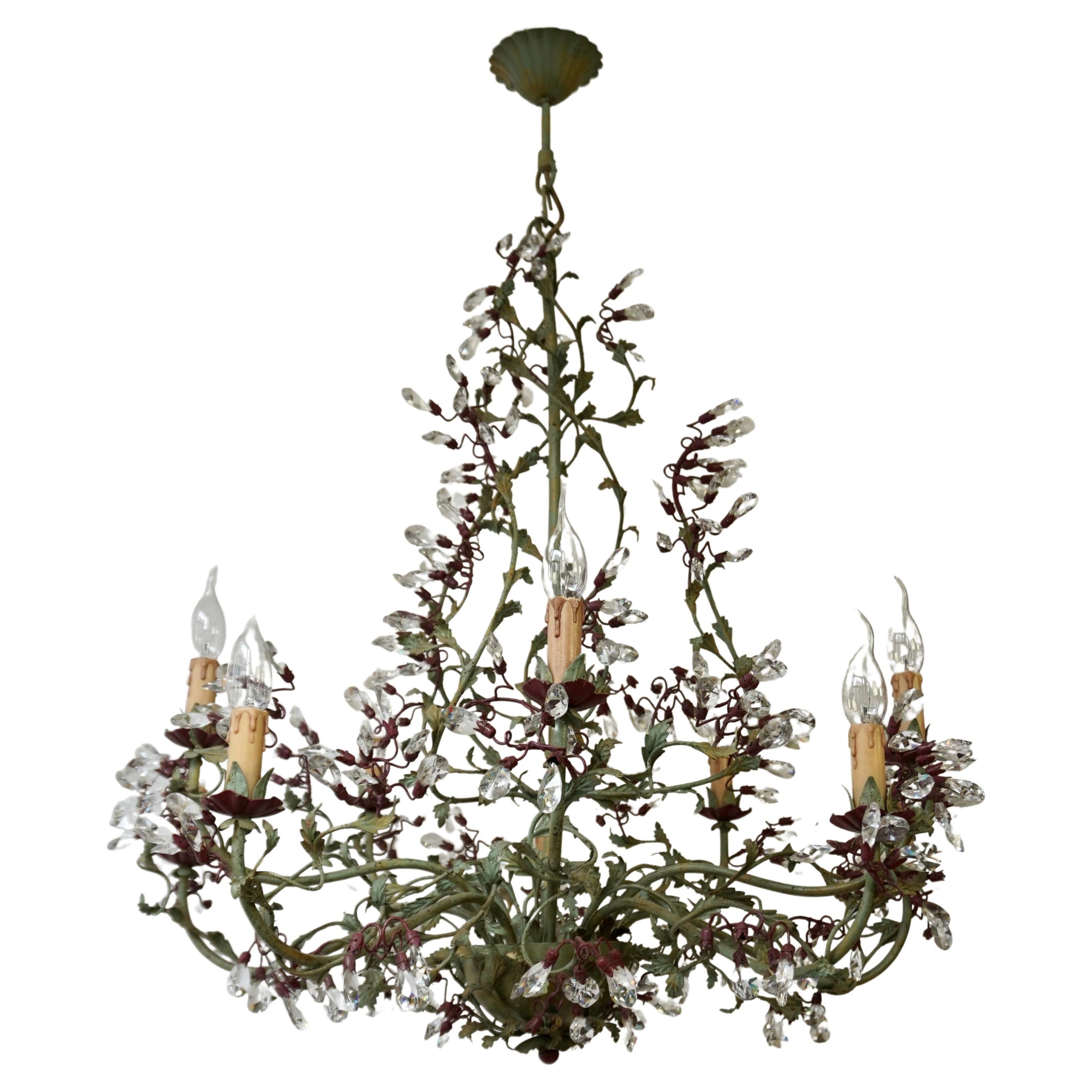 Very elegant contemporary Italian 10 arm large chandelier having green and bordeaux red painted metal body and arms decorated with clear crystal glass . 
By Sergio Mechini.

The lamp has ten sockets for small incandescent lamps with screw base or