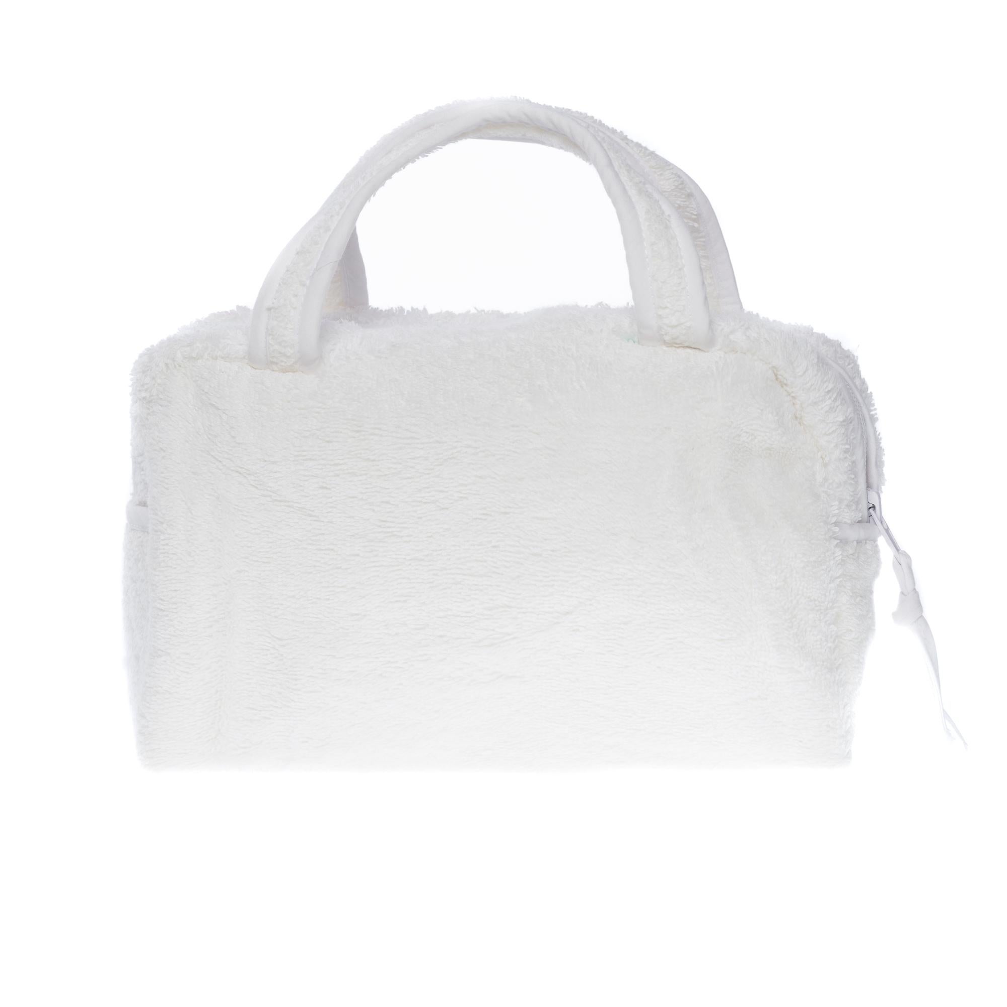 Designed by John Galliano for Dior in the 1990s. This handbag is made of white cotton with the emblematic slogan 