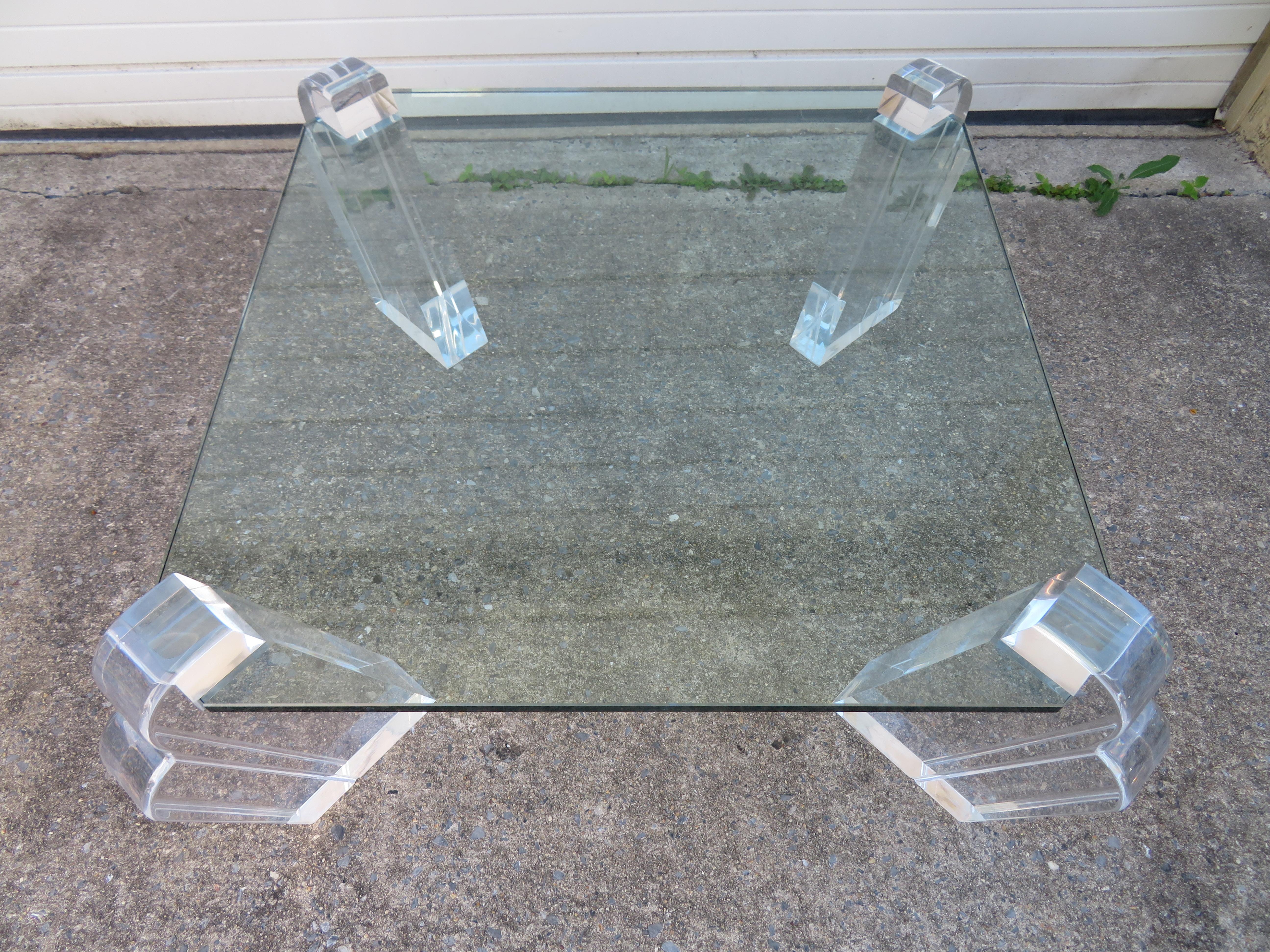 Gorgeous Karl Springer style Lucite pillar coffee table. We love the double arched chunky Lucite pillars that lean slightly backward-really cool. One pillar is slightly thinner than the others-three pillars are 3.5