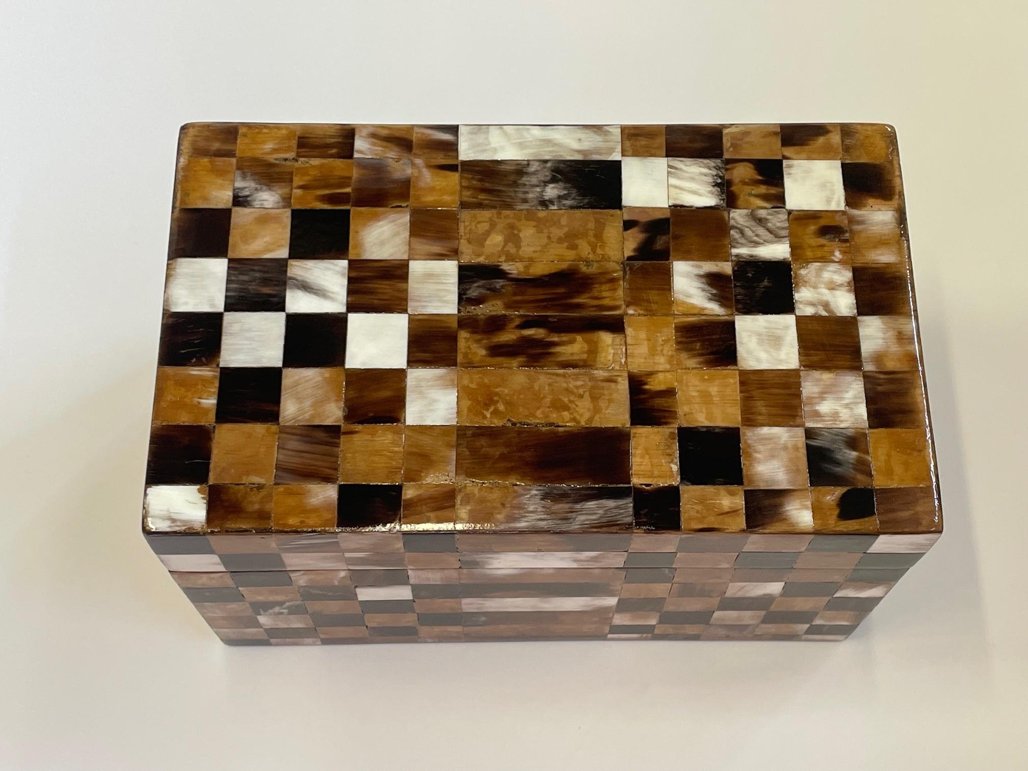 Handsome large decorative box from Italy having meticulously patterned horn veneer with a checkboard design.