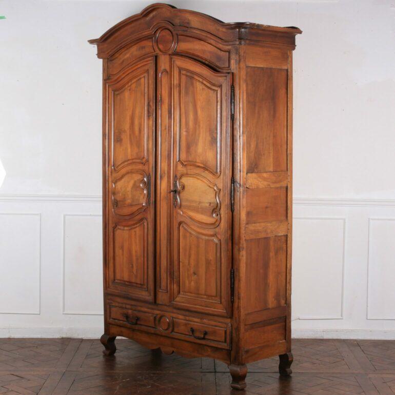Louis XVI Style Walnut Armoire From Paris with well upholstered interior. Circa 1780. Fabulous Patina and deep rich color.
Dimensions:
W: 57″
D: 24″
T: 97″