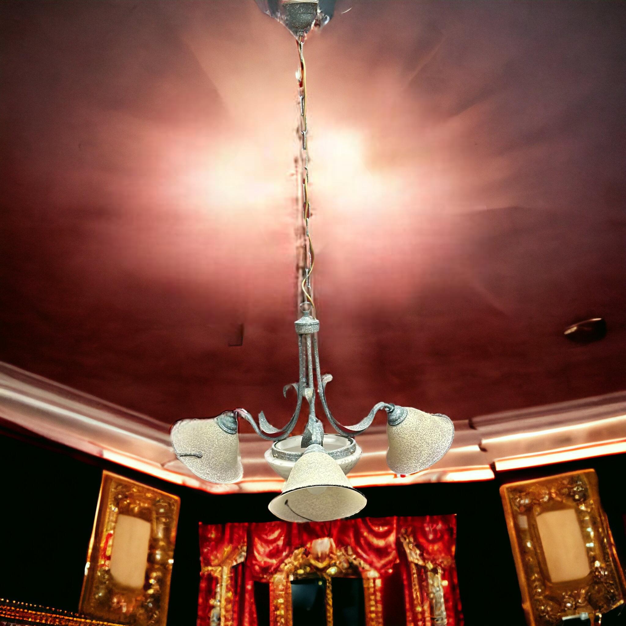 Petite Florentine style four-light chandelier. Functions as is with four E27 / 110 Volt light bulbs. Can take up to 60 Watts each bulb. Beautiful metal three arm chandelier with 3 glass shades for 3 light bulbs and a glass bowl in the middle with